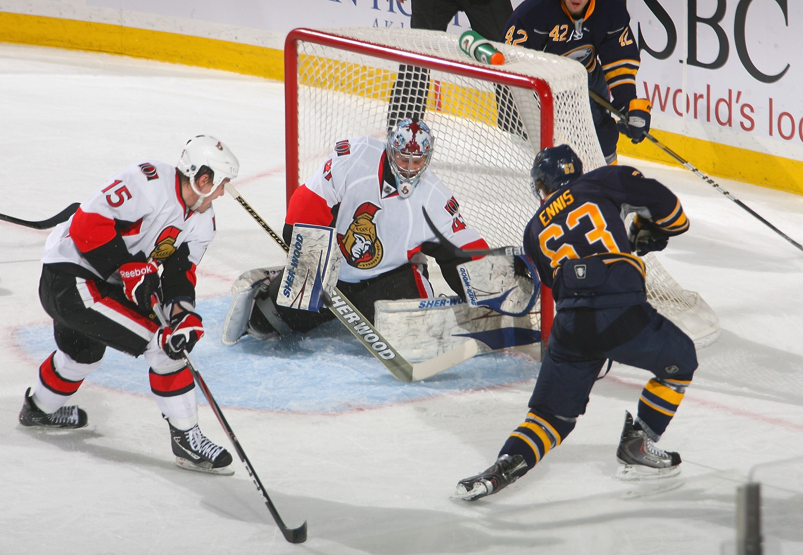 BUFFALO, NY - FEBRUARY 25: Craig Anderson #41 of the Ottawa Senators makes a save against Tyler Ennis #63 of the Buffalo Sabres as Zack Smith #15 of the Senators looks on at HSBC Arena on February 25, 2011 in Buffalo, New York.  (Photo by Rick Stewart/Get