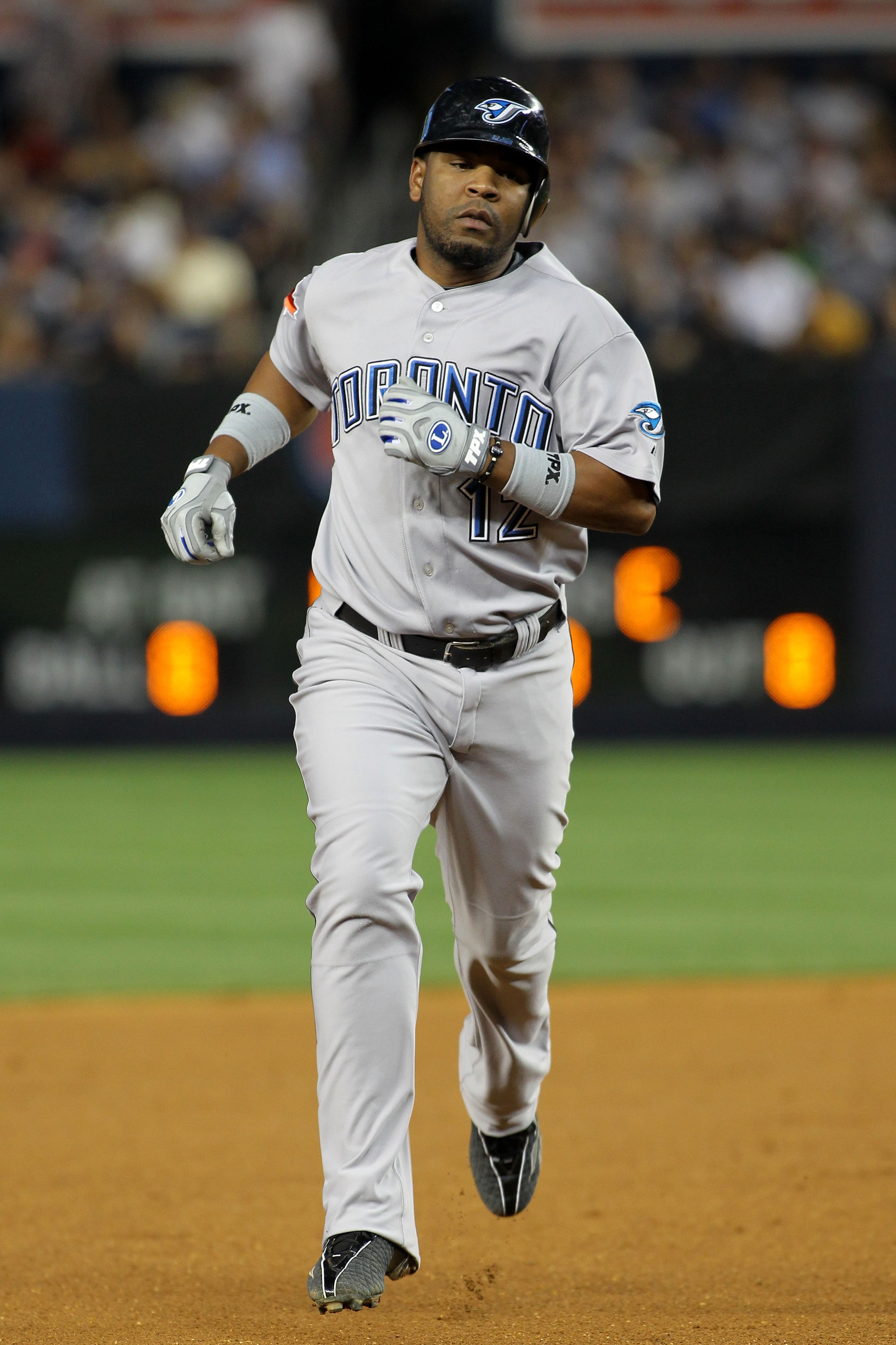 NEW YORK - AUGUST 02:  Edwin Encarnacion #12 of the Toronto Blue Jays rounds the bases after hitting a two run home run in the fifth inning against the New York Yankees on August 2, 2010 at Yankee Stadium in the Bronx borough of New York City.  (Photo by