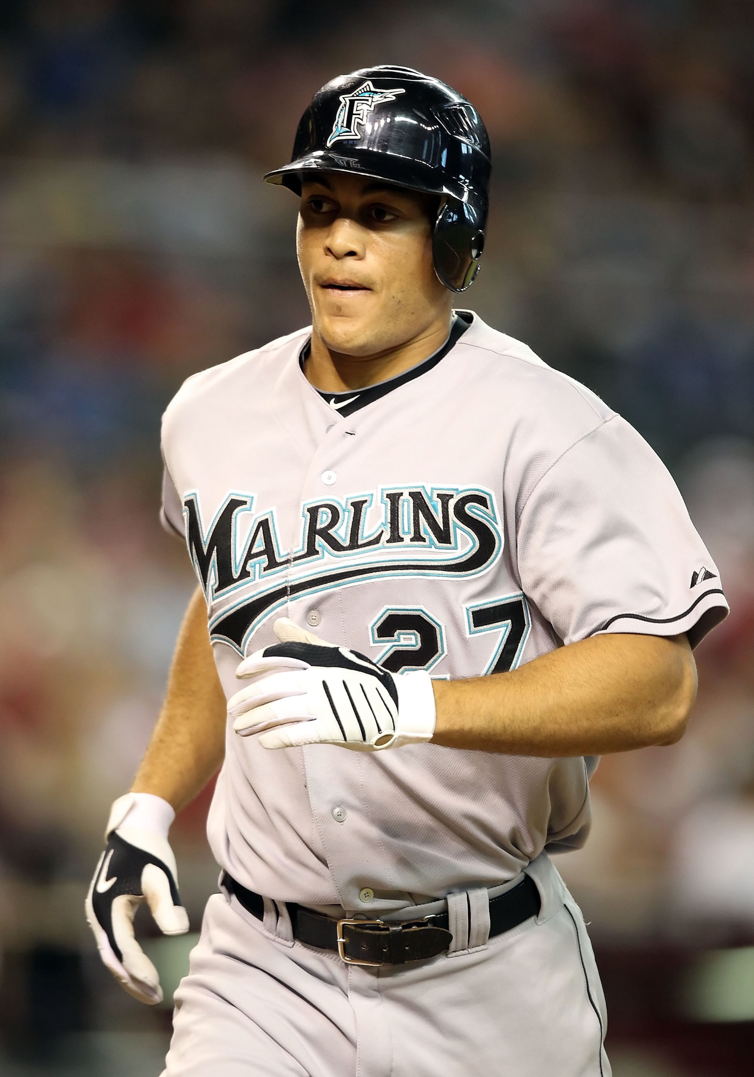 PHOENIX - JULY 10:  Mike Stanton #27 of the Florida Marlins rounds the bases after hitting a solo home run against the Arizona Diamondbacks during the fifth inning of the Major League Baseball game at Chase Field on July 10, 2010 in Phoenix, Arizona.  The