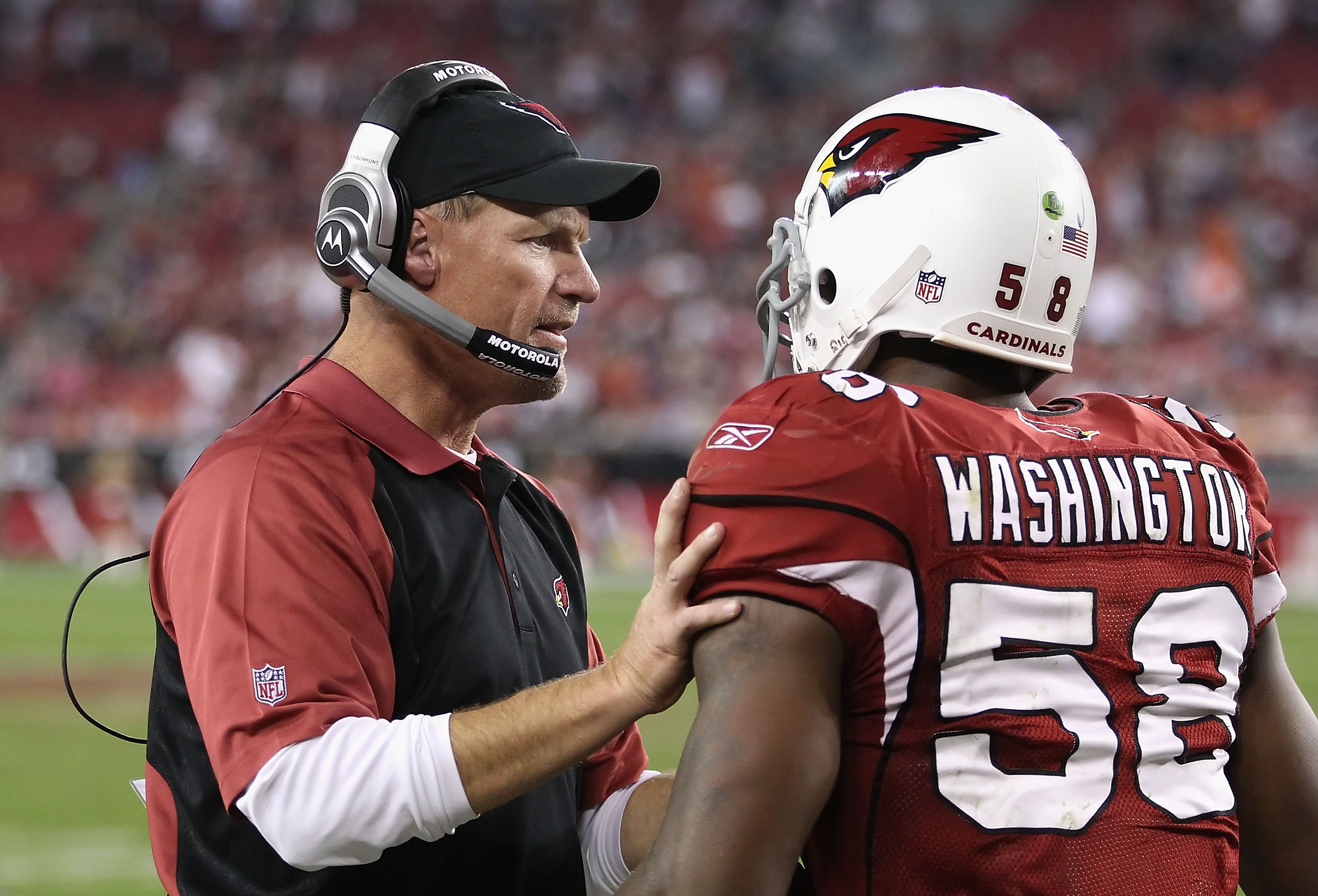 13 SEP 2009: Head Coach Raheem Morris of the Buccaneers in the red shirt  watches the instant replay during the game between the Dallas Cowboys and  the Tampa Bay Buccaneers at Raymond