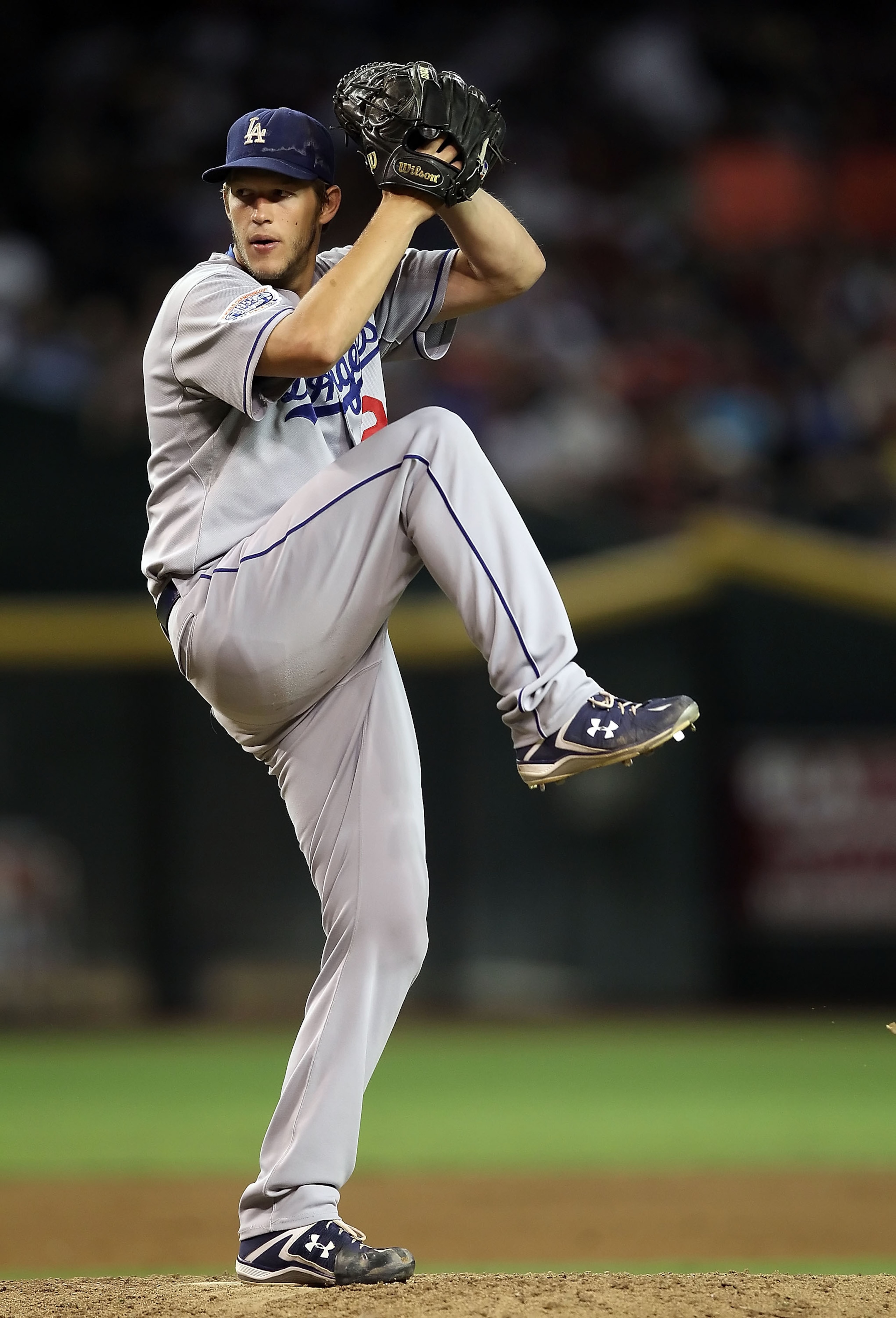 PHOENIX - SEPTEMBER 24:  Starting pitcher Clayton Kershaw #22 of the Los Angeles Dodgers pitches against the Arizona Diamondbacks during the Major League Baseball game at Chase Field on September 24, 2010 in Phoenix, Arizona.  (Photo by Christian Petersen