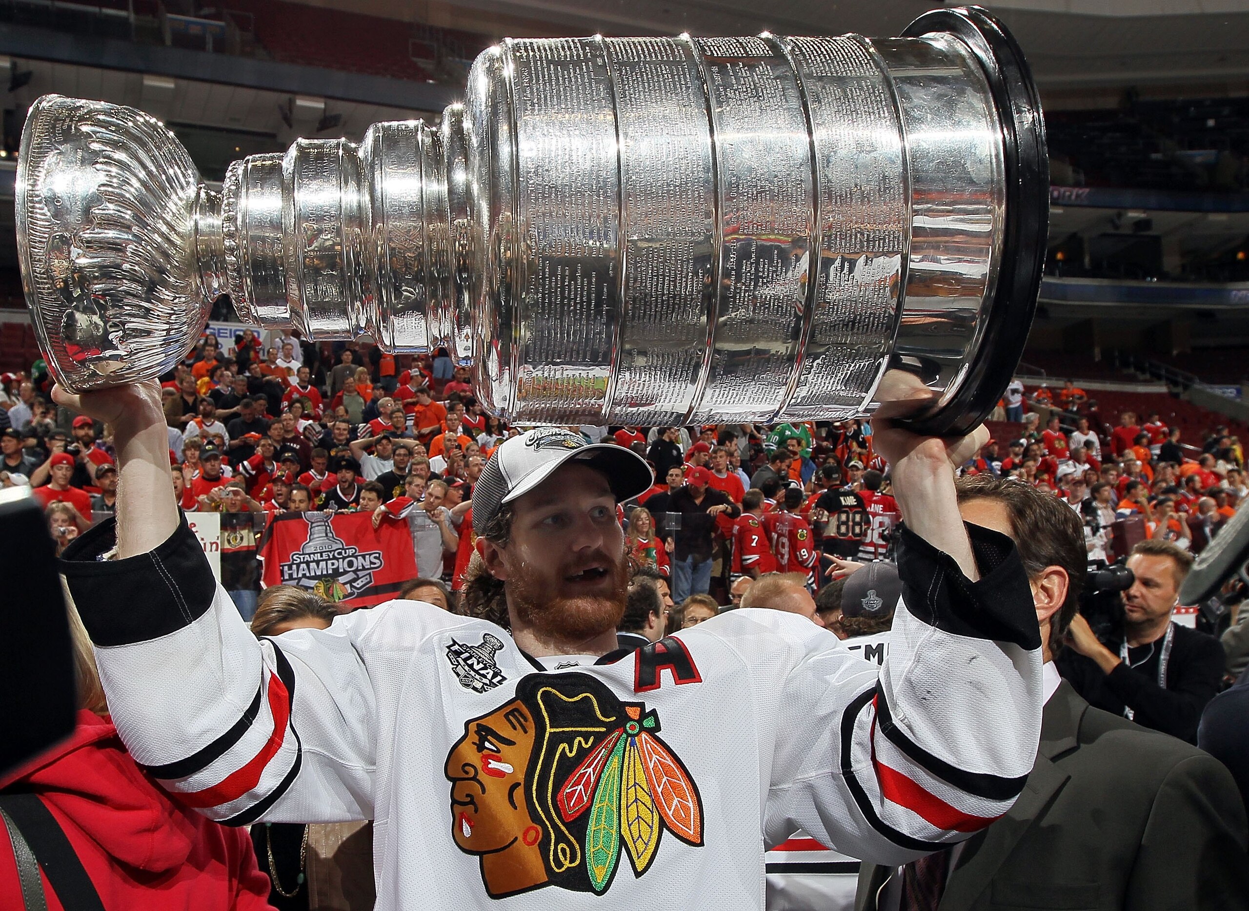 PHILADELPHIA - JUNE 09:  Duncan Keith #2 of the Chicago Blackhawks hoists the Stanley Cup after teammate Patrick Kane #88 scored the game-winning goal in overtime to defeat the Philadelphia Flyers 4-3 and win the Stanley Cup in Game Six of the 2010 NHL St
