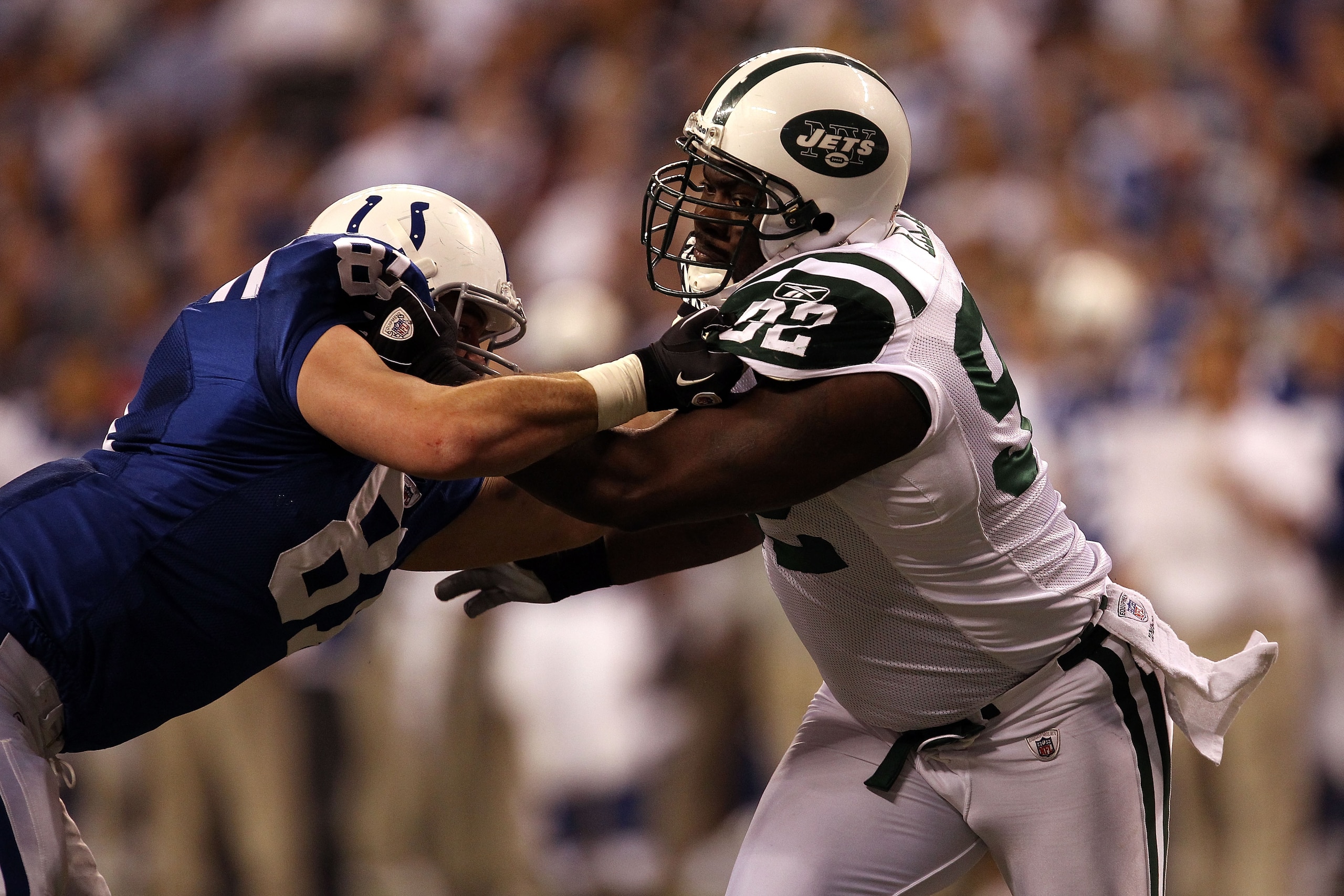INDIANAPOLIS, IN - JANUARY 08:  Defensive end Shaun Ellis #92 of the New York Jets rushes the passer against Bobby Eldridge #81 of the Indianapolis Colts during their 2011 AFC wild card playoff game at Lucas Oil Stadium on January 8, 2011 in Indianapolis,