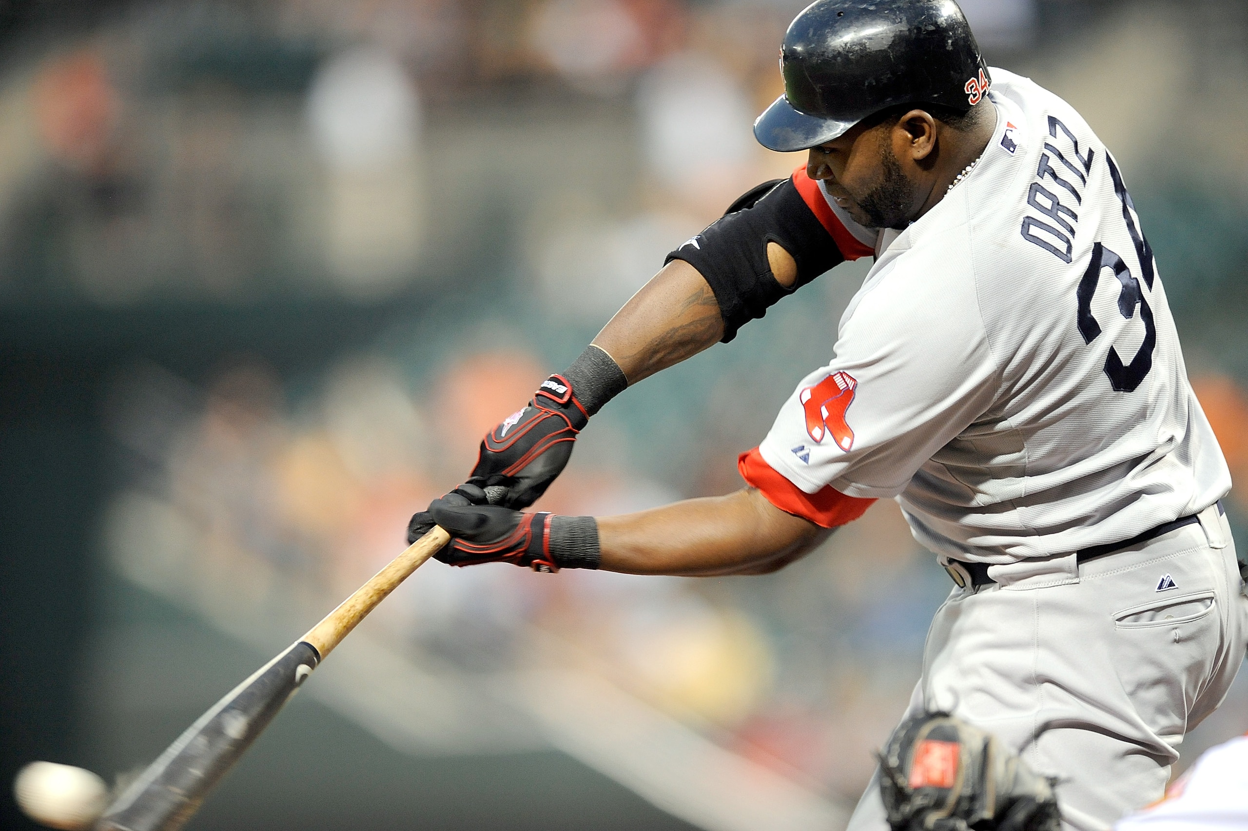 BALTIMORE - SEPTEMBER 02:  David Ortiz #34 of the Boston Red Sox hits a single in the second inning against the Baltimore Orioles at Camden Yards on September 2, 2010 in Baltimore, Maryland.  (Photo by Greg Fiume/Getty Images)