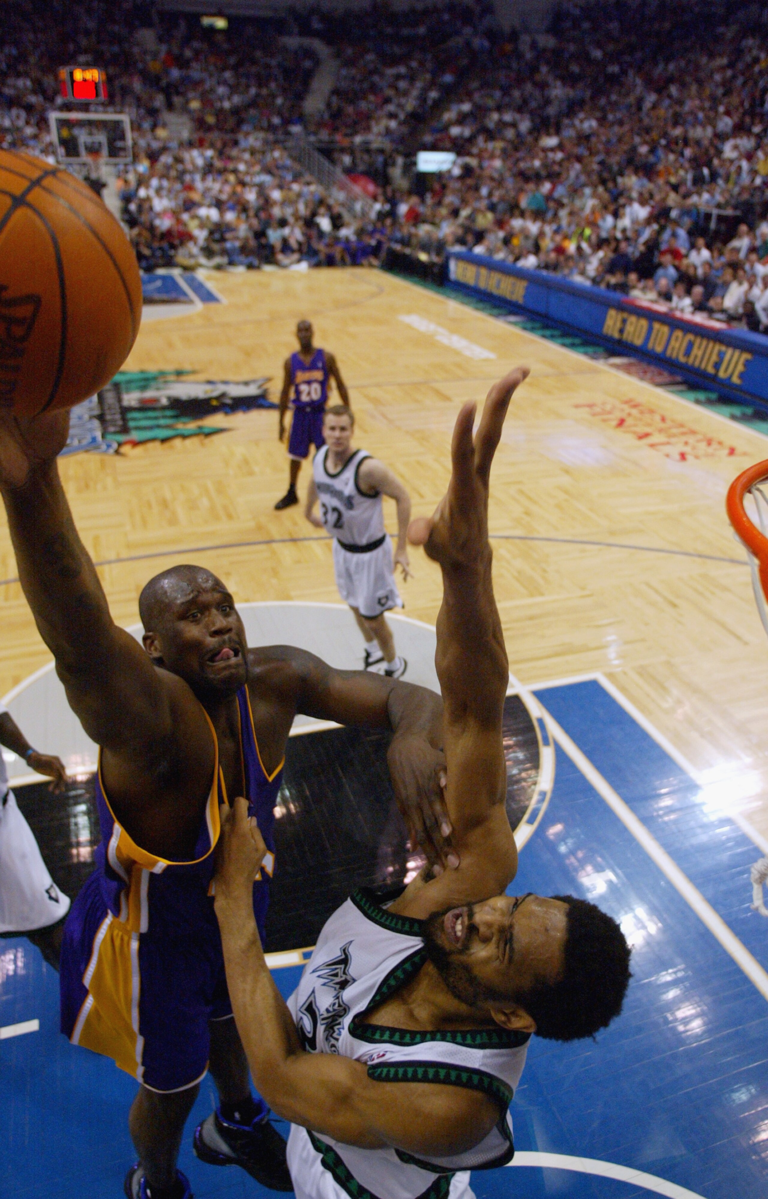 MINNEAPOLIS - MAY 29: Shaquille O'Neal #34 of the Los Angeles Lakers shoots over Michael Olowokandi #34 of the Minnesota Timberwolves in Game five of the Western Conference Finals during the 2004 NBA Playoffs at Target Center on May 29, 2004 in Minneapol MINNEAPOLIS - MAY 29: Shaquille O'Neal #34 of the Los Angeles Lakers shoots over Michael Olowokandi #34 of the Minnesota Timberwolves in Game five of the Western Conference Finals during the 2004 NBA Playoffs at Target Center on May 29, 2004 in Minneapol