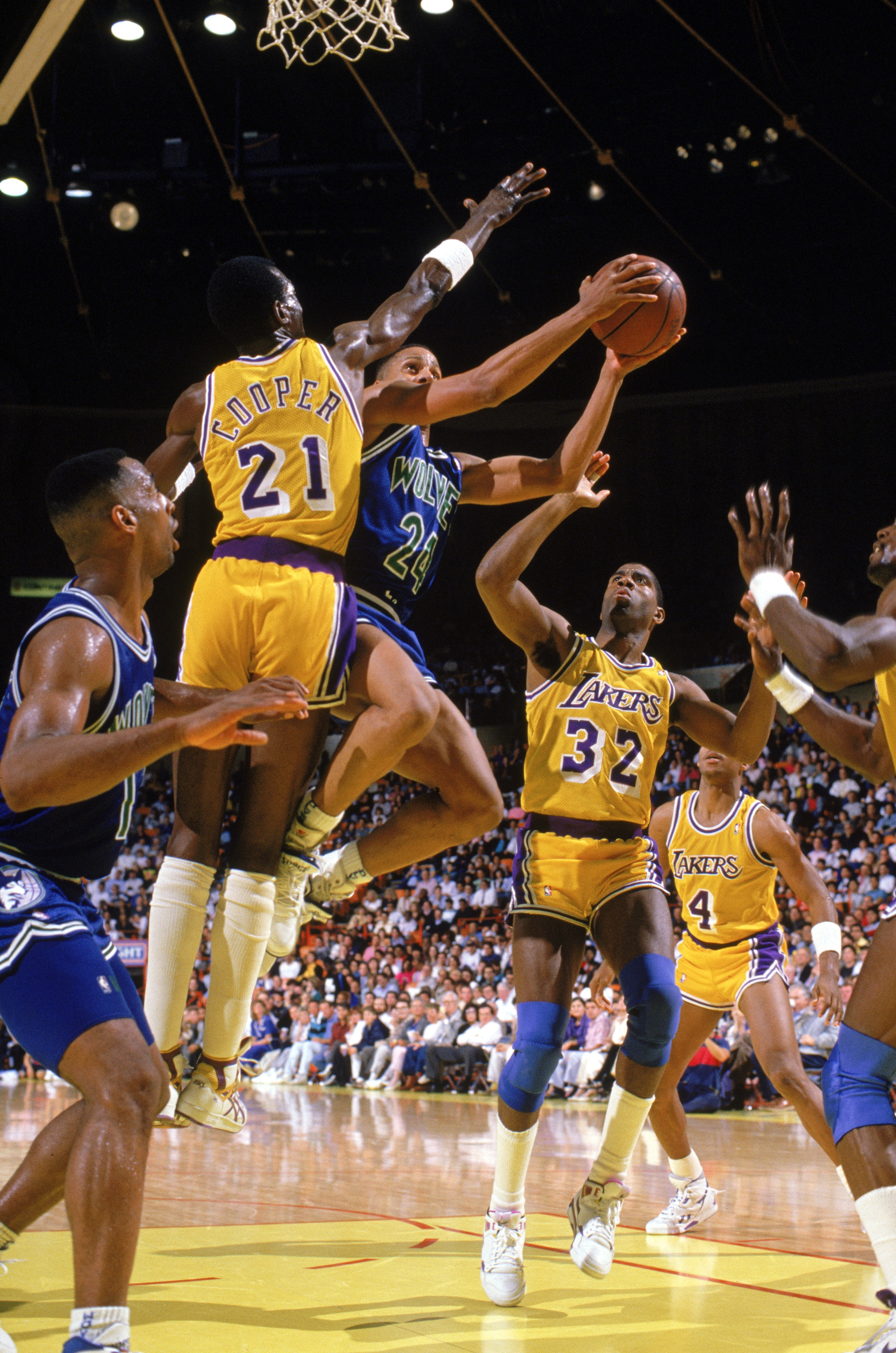 LOS ANGELES - 1990: Pooh Richardson #24 of the Minnesota Timberwolves goes up for the shot against Michael Cooper #21 of the Los Angeles Lakers in a game at the Great Western Forum in Los Angeles, California during the 1989-1990 NBA season. (Photo by Mi LOS ANGELES - 1990: Pooh Richardson #24 of the Minnesota Timberwolves goes up for the shot against Michael Cooper #21 of the Los Angeles Lakers in a game at the Great Western Forum in Los Angeles, California during the 1989-1990 NBA season. (Photo by Mi