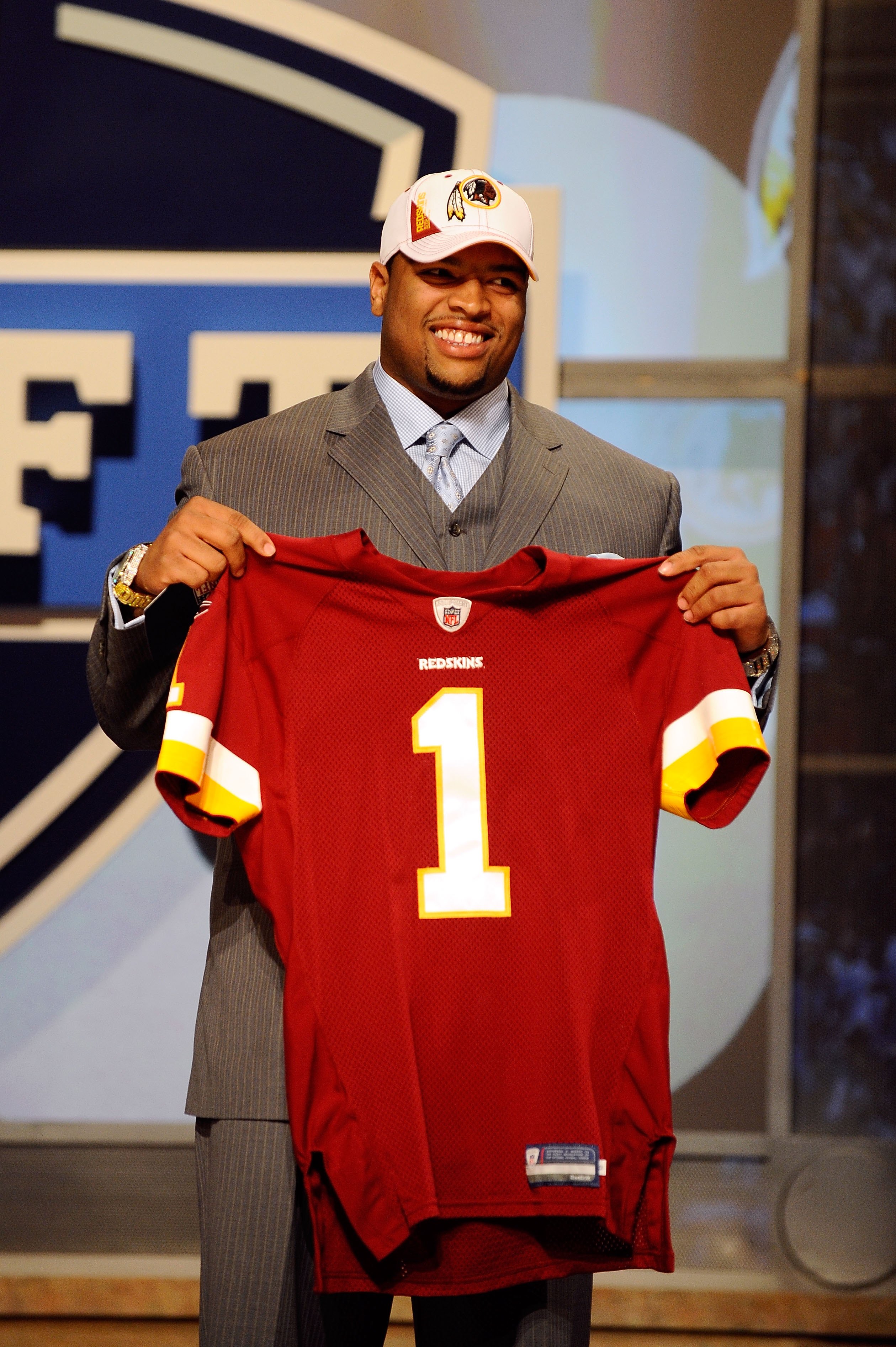 NEW YORK - APRIL 22:  Trent Williams from the Oklahoma Sooners holds a Washington Redskins jersey after Washington selected Williams number 4 overall during the first round of the 2010 NFL Draft at Radio City Music Hall on April 22, 2010 in New York City.