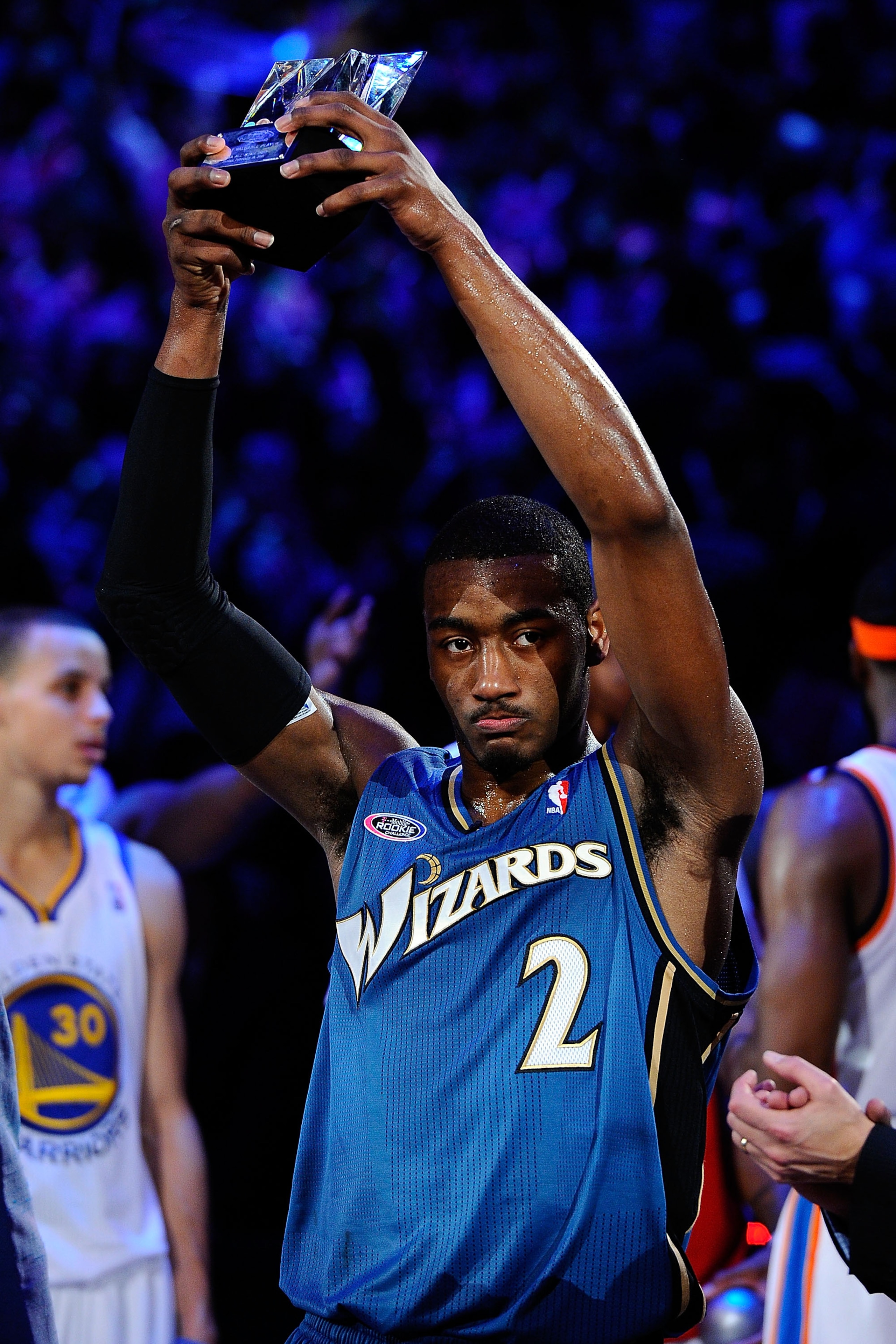 LOS ANGELES, CA - FEBRUARY 18:  John Wall #2 of the Washington Wizards and the Rookie Team holds up the MVP trophy after the T-Mobile Rookie Challenge and Youth Jam at Staples Center on February 18, 2011 in Los Angeles, California.  (Photo by Kevork Djans
