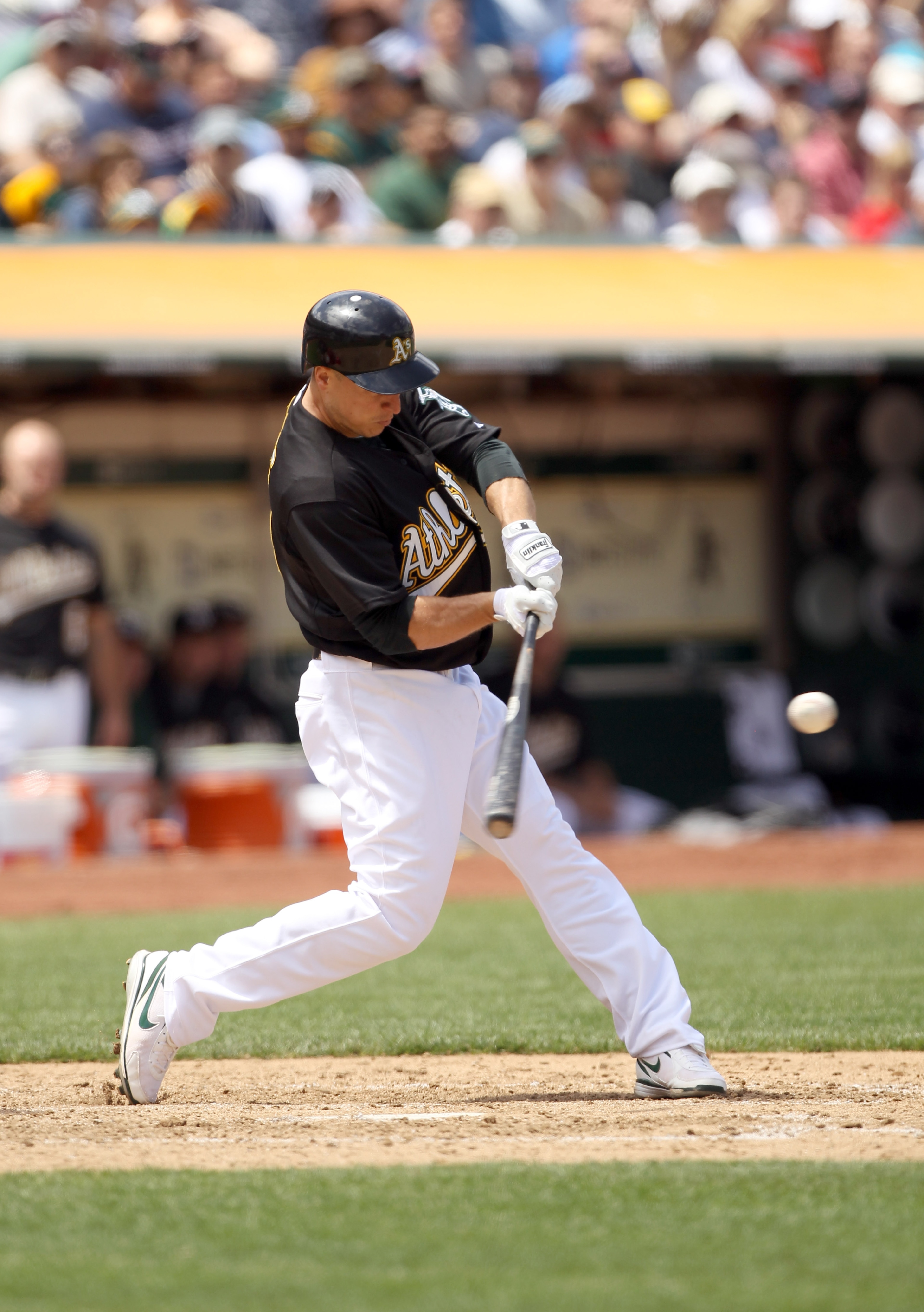 OAKLAND, CA - JULY 21: Mark Ellis #14 of the Oakland Athletics bats against the Boston Red Sox at the Oakland-Alameda County Coliseum on July 21, 2010 in Oakland, California. (Photo by Ezra Shaw/Getty Images) OAKLAND, CA - JULY 21: Mark Ellis #14 of the Oakland Athletics bats against the Boston Red Sox at the Oakland-Alameda County Coliseum on July 21, 2010 in Oakland, California. (Photo by Ezra Shaw/Getty Images)