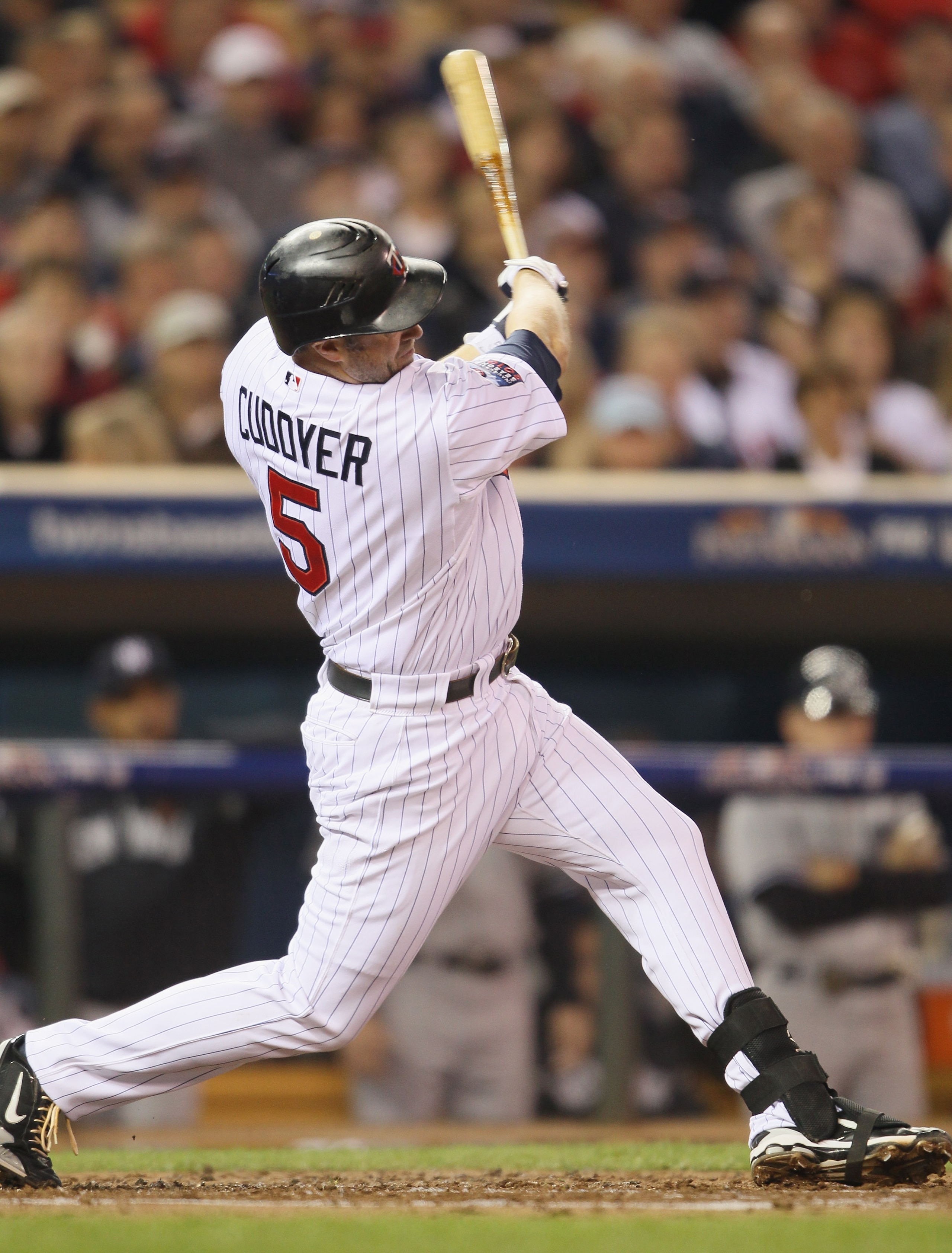 MINNEAPOLIS - OCTOBER 06:  Michael Cuddyer #5 of the Minnesota Twins hits a two run homer in the second inning against the New York Yankees during game one of the ALDS on October 6, 2010 at Target Field in Minneapolis, Minnesota.  (Photo by Elsa/Getty Ima