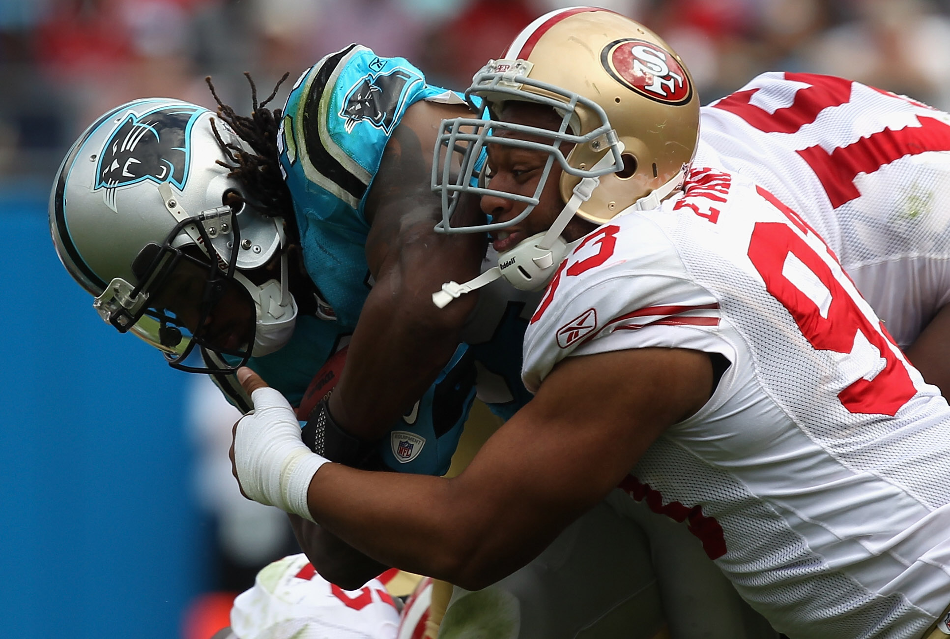CHARLOTTE, NC - OCTOBER 24:  Demetric Evans #93 of the San Francisco 49ers tackles DeAngelo Williams #34 of the Carolina Panthers during their game at Bank of America Stadium on October 24, 2010 in Charlotte, North Carolina.  (Photo by Streeter Lecka/Gett