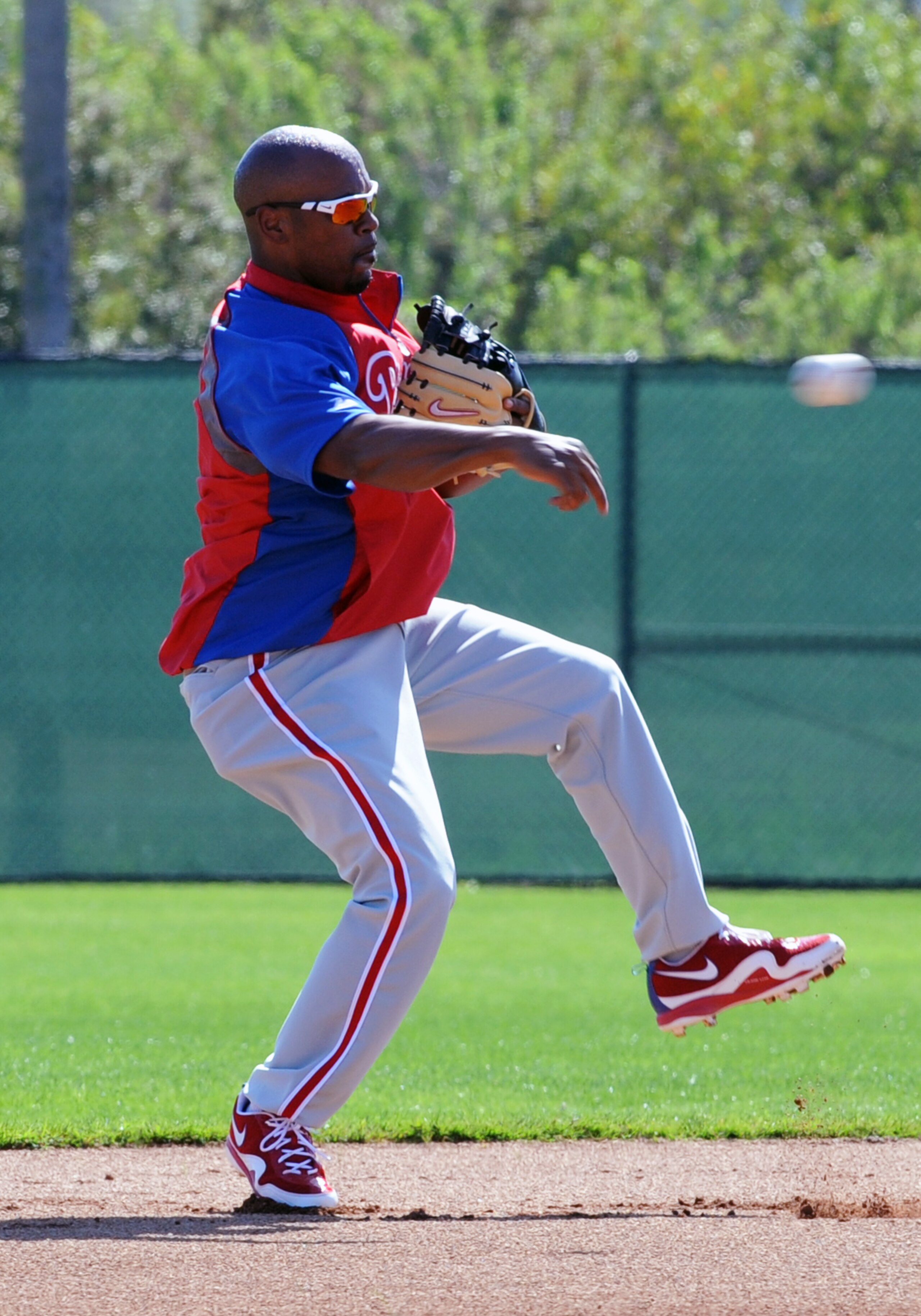 CLEARWATER, FL - FEBRUARY 19:  Infielder Jimmy Rollins #11 of the Philadelphia Phillies throws to first base during a spring training workout February 19, 2011 the Carpenter Complex at Bright House Field in Clearwater, Florida. (Photo by Al Messerschmidt/