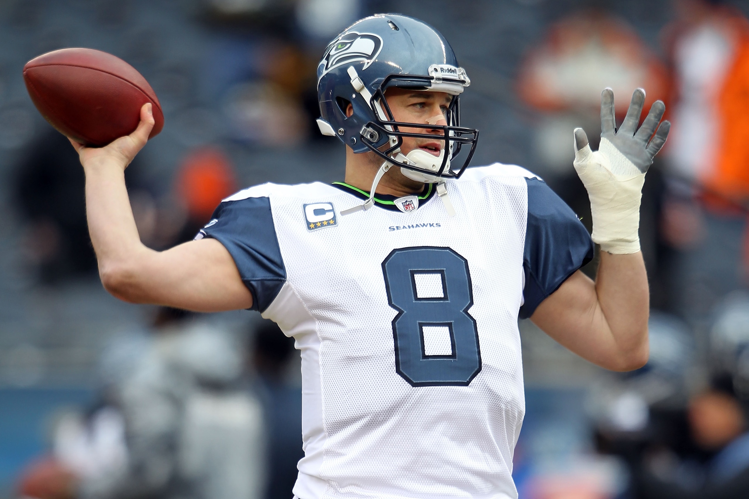 CHICAGO, IL - JANUARY 16:  Quarterback Matt Hasselbeck #8 of the Seattle Seahawks looks to throw the ball during pregame before taking on the Chicago Bears in the 2011 NFC divisional playoff game at Soldier Field on January 16, 2011 in Chicago, Illinois. 