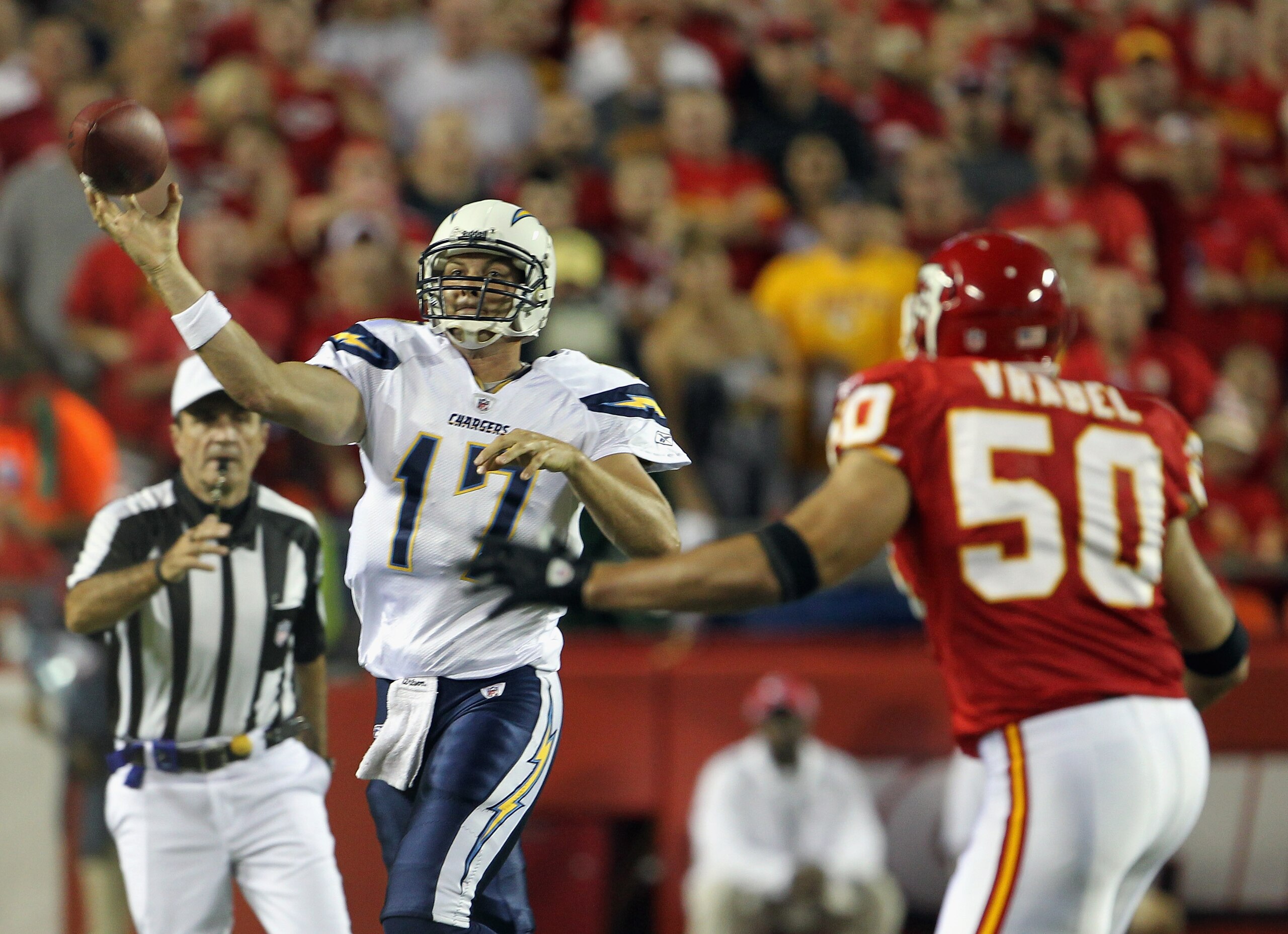 KANSAS CITY, MO - SEPTEMBER 13:  Quarterback Philip Rivers #17 of the San Diego Chargers passes as he is rushed by Mike Vrabel #50 of the Kansas City Chiefs during the 1st quarter of the game on September 13, 2010 at Arrowhead Stadium in Kansas City, Miss