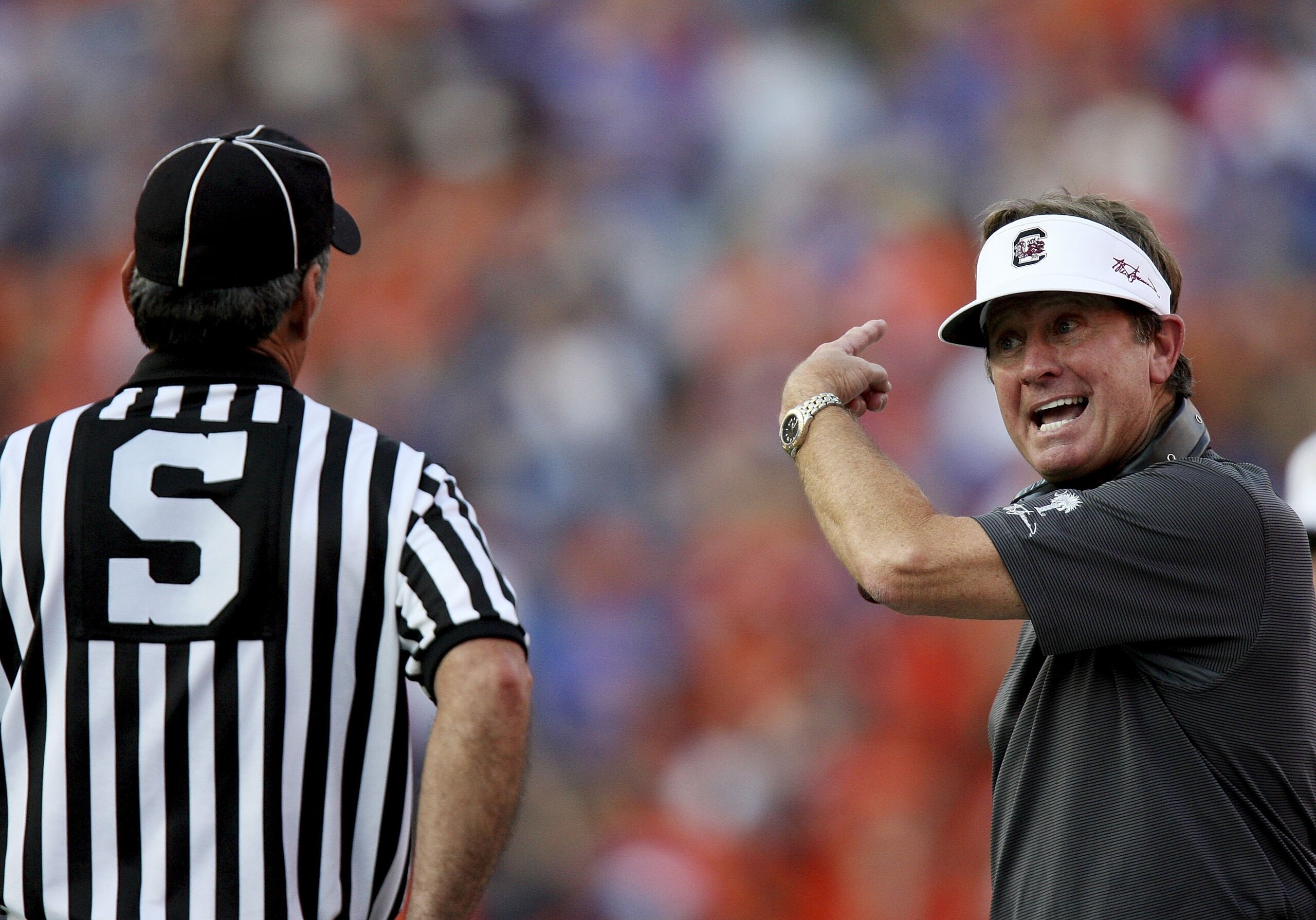 GAINESVILLE, FL - NOVEMBER 11:  Head coach Steve Spurrier of the South Carolina Gamecocks argues with side judge Bobby Moreau after a pass interference penalty against his team in the second quarter while taking on his former team, the University of Flori