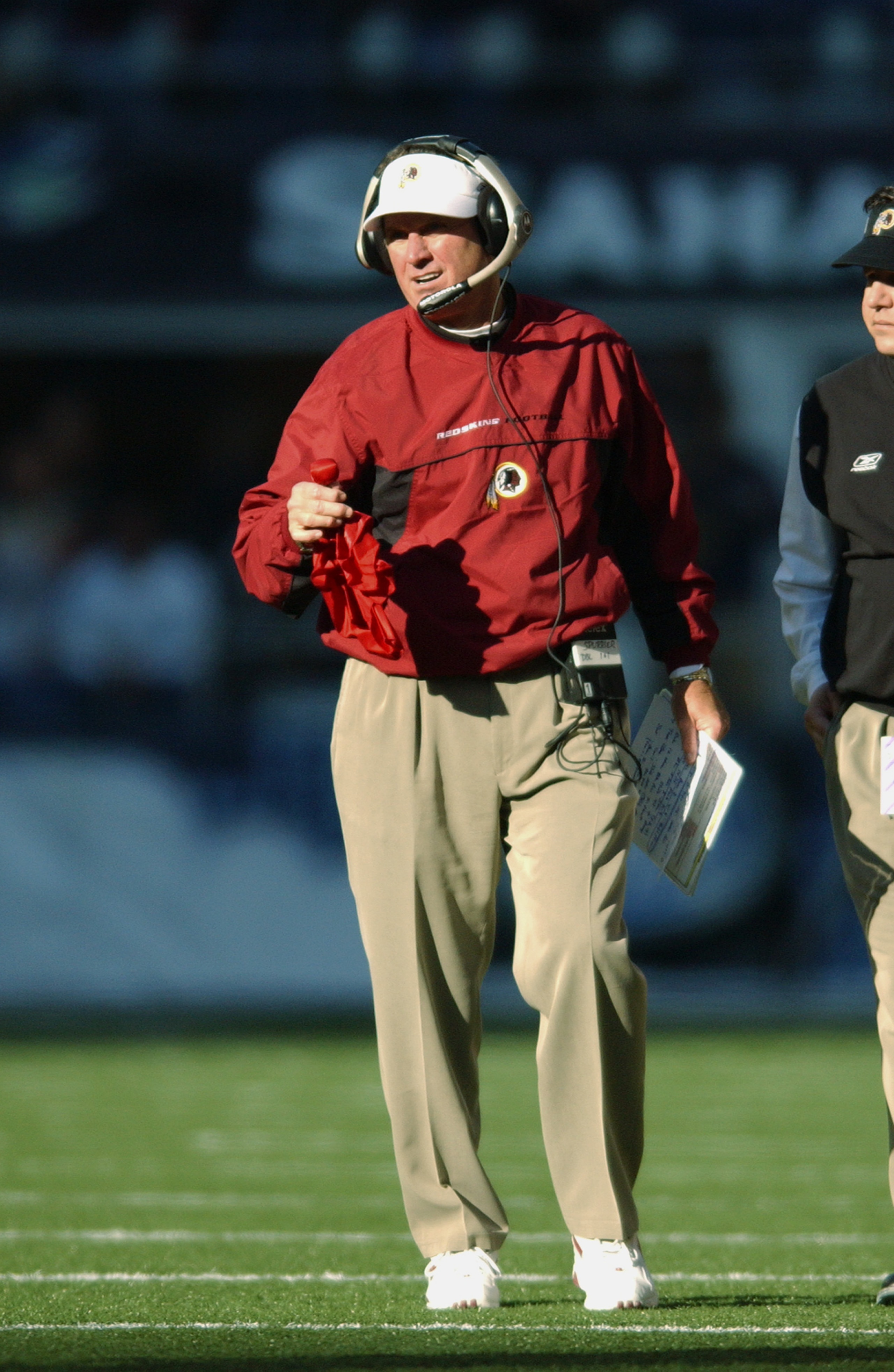 SEATTLE - NOVEMBER 3:  Head Coach Steve Spurrier of the Washington Redskins draws the ref's attention with the red flag to dispute a call during the NFL game against the Seattle Seahawks at Seahawks Stadium on November 3, 2002 in Seattle, Washington. The