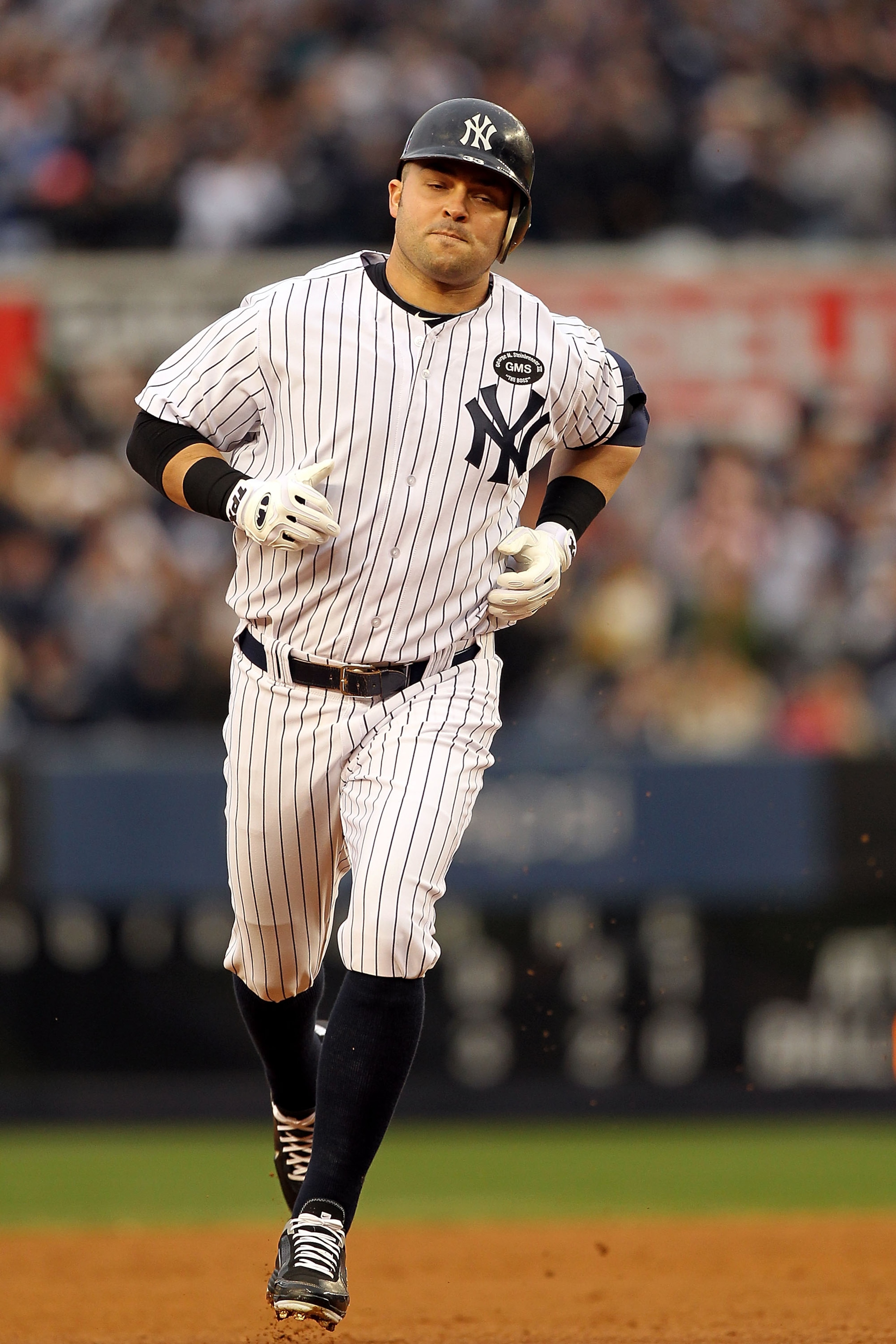 NEW YORK - OCTOBER 20:  Nick Swisher #33 of the New York Yankees runs the bases on his solo home run in the bottom of the third inning against the Texas Rangers in Game Five of the ALCS during the 2010 MLB Playoffs at Yankee Stadium on October 20, 2010 in