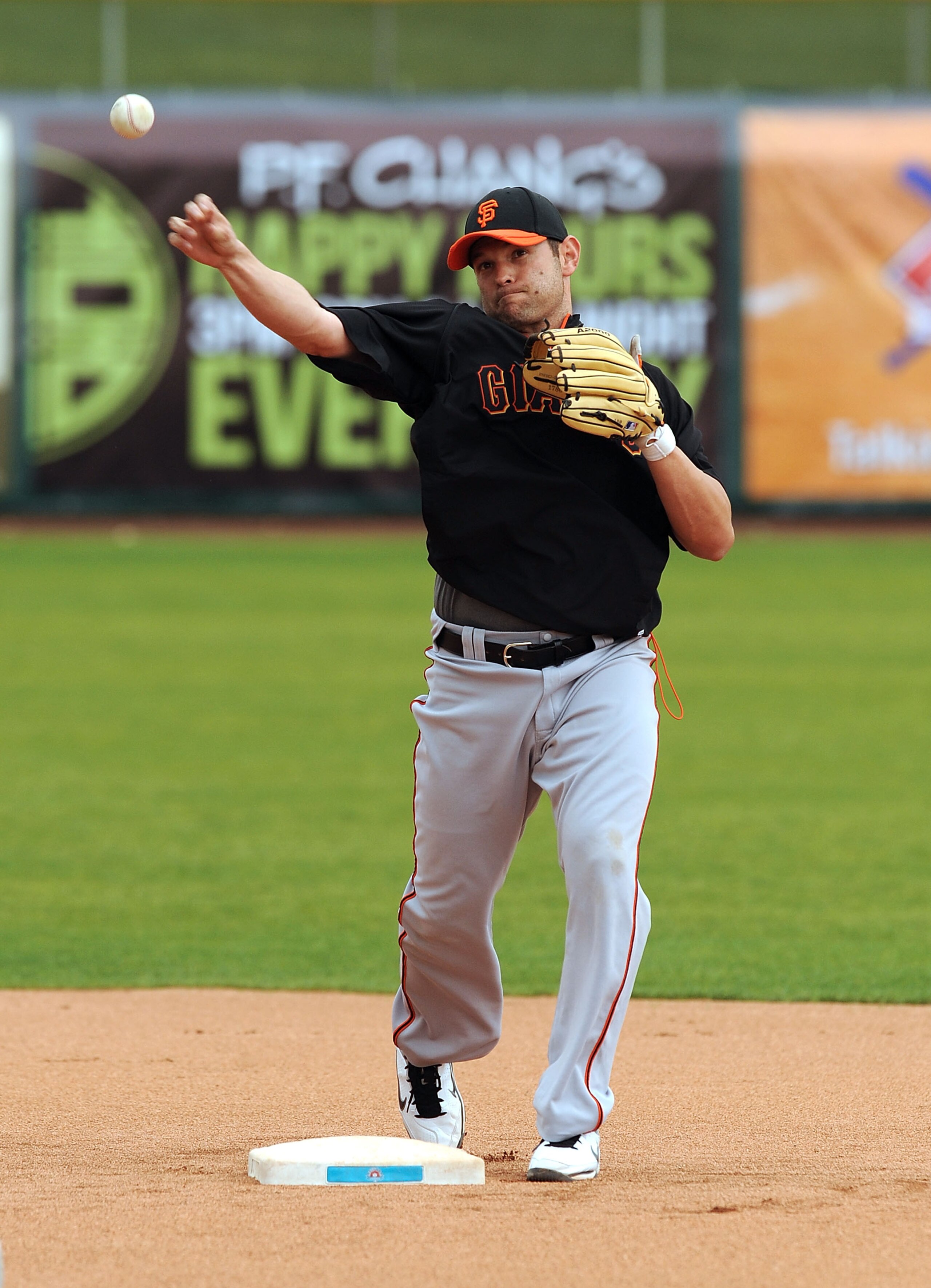SCOTTSDALE, AZ - FEBRUARY 19:  Freddy Sanchez #21 of the San Francisco Giants throws the ball to first base during spring work outs at Scottsdale Stadium on February 19, 2011 in Scottsdale, Arizona.  (Photo by Norm Hall/Getty Images)