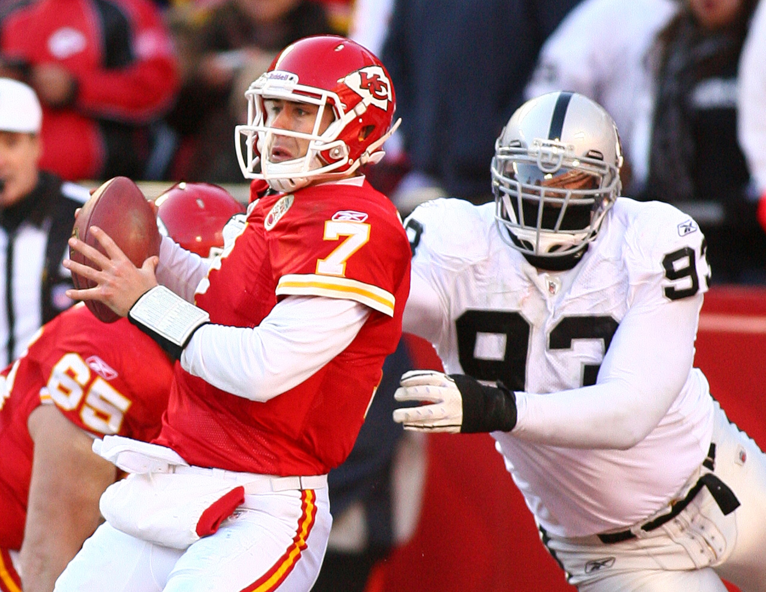KANSAS CITY, MO - JANUARY 02:  Quarterback Matt Cassel #7 of the Kansas City Chiefs is hit as he throws by defensive tackle Tommy Kelly #93 of the Oakland Raiders in a game at Arrowhead Stadium on January 2, 2011 in Kansas City, Missouri.  (Photo by Tim U