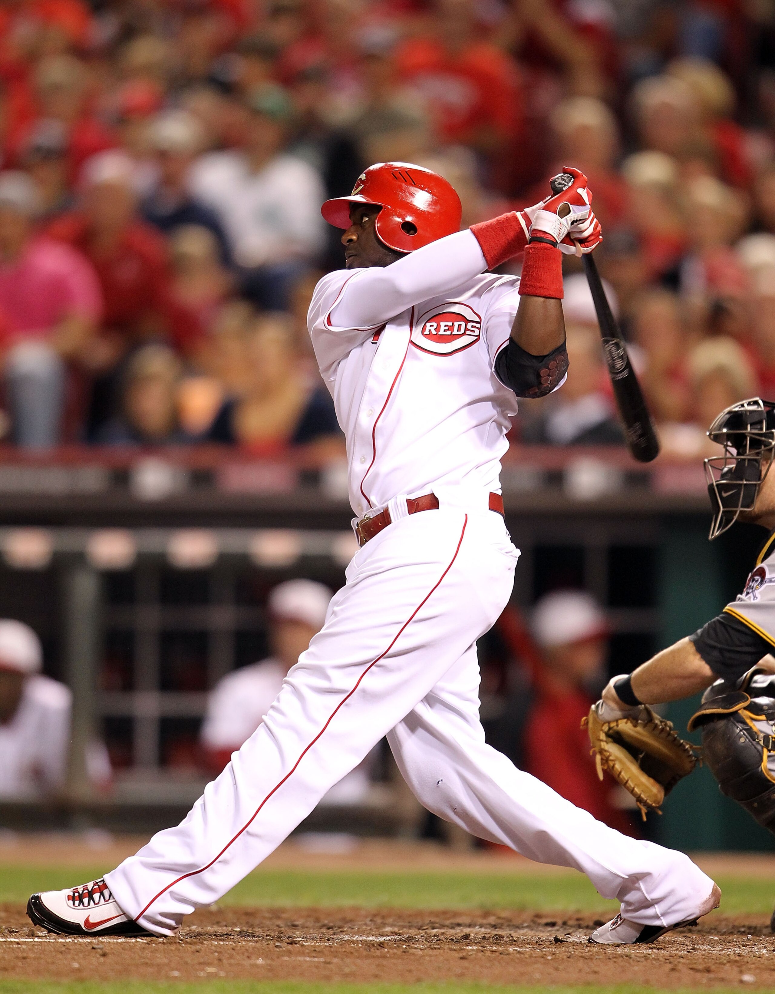 CINCINNATI - SEPTEMBER 11:  Brandon Phillips #4 of the Cincinnati Reds swings at a pitch during the game against the Pittsburg Pirates at Great American Ball Park on September 11, 2010 in Cincinnati, Ohio.  (Photo by Andy Lyons/Getty Images)