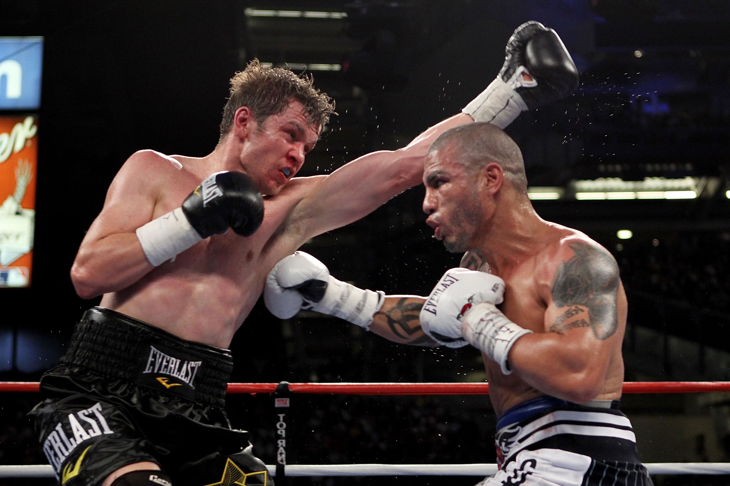 NEW YORK - JUNE 05:  (L-R) Yuri Foreman exchanges blows with Miguel Cotto of Puerto Rico during the WBA world super welterweight title fight on June 5, 2010 at Yankee Stadium in the Bronx borough of New York City.  (Photo by Al Bello/Getty Images)