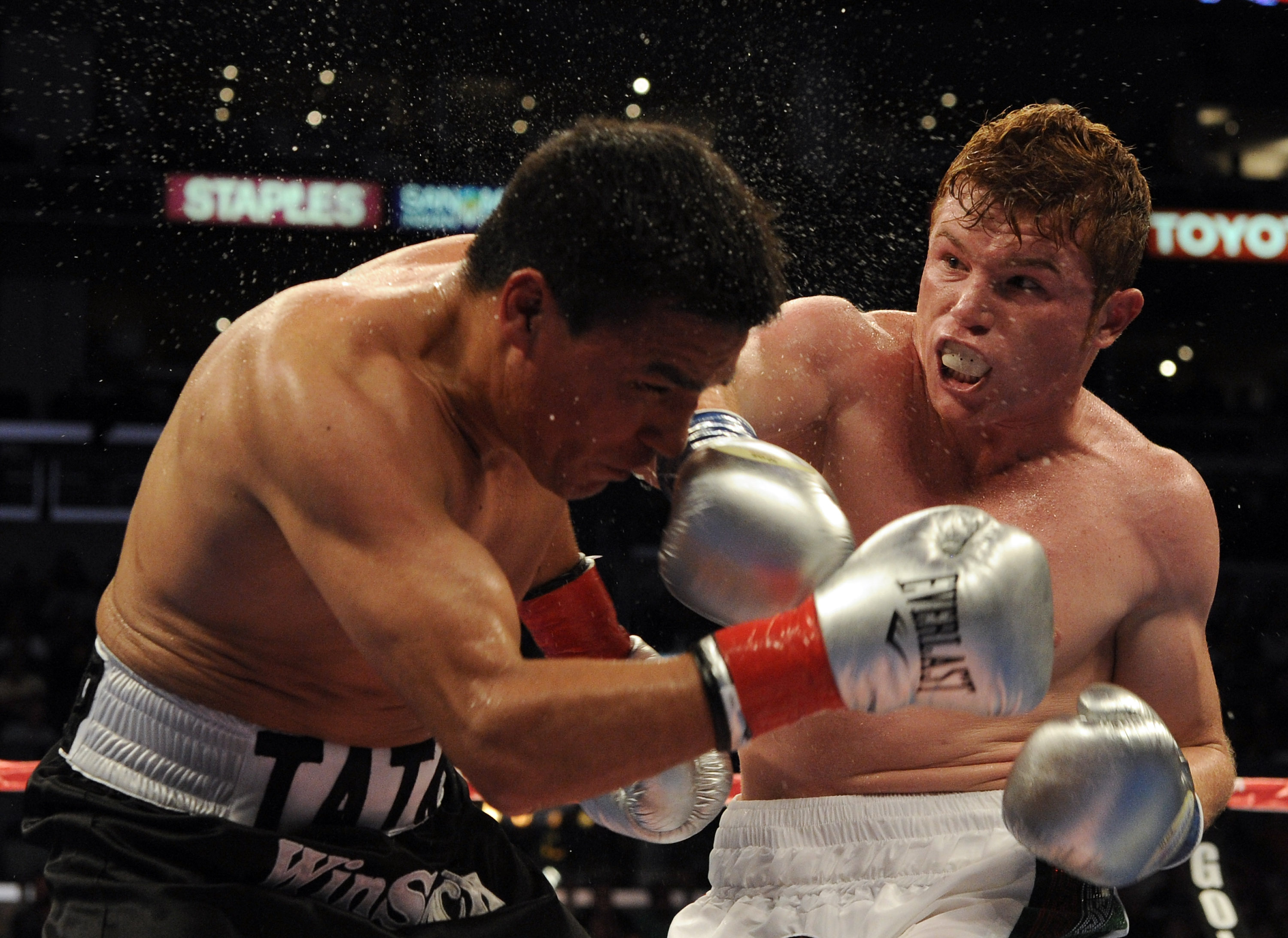 LOS ANGELES, CA - SEPTEMBER 18: Saul Alvarez of Mexico hits Carlos Baldomir of Argentina in the WBC Super Welterweight Silver Title fight at Staples Center on September 18, 2010 in Los Angeles, California. (Photo by Harry How/Getty Images)