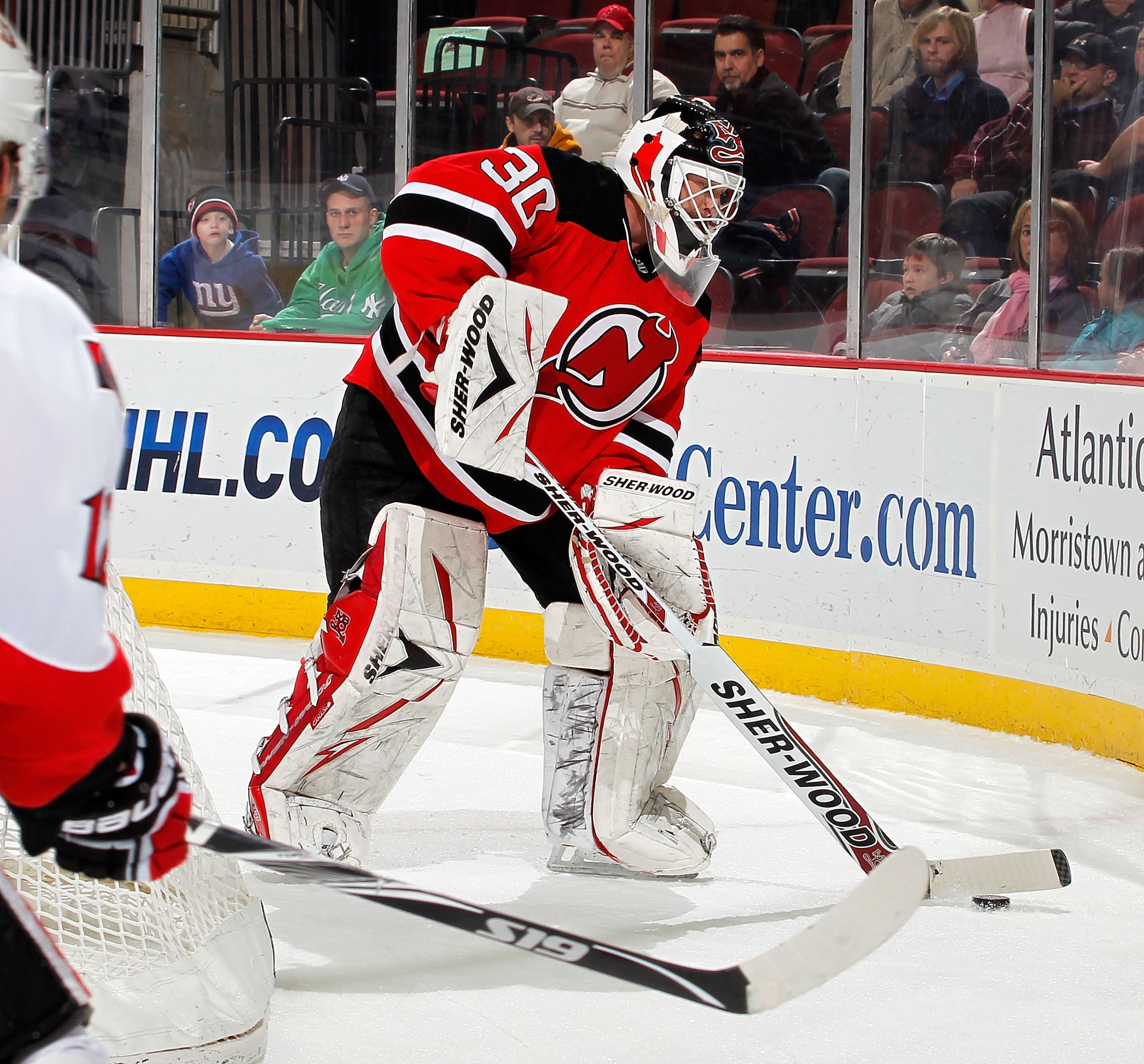 NEWARK, NJ - FEBRUARY 01:  Goalie Martin Brodeur #30 of the New Jersey Devils plays the puck behind the net during an NHL hockey game against the Ottawa Senators at the Prudential Center on February 1, 2011 in Newark, New Jersey.  (Photo by Paul Bereswill