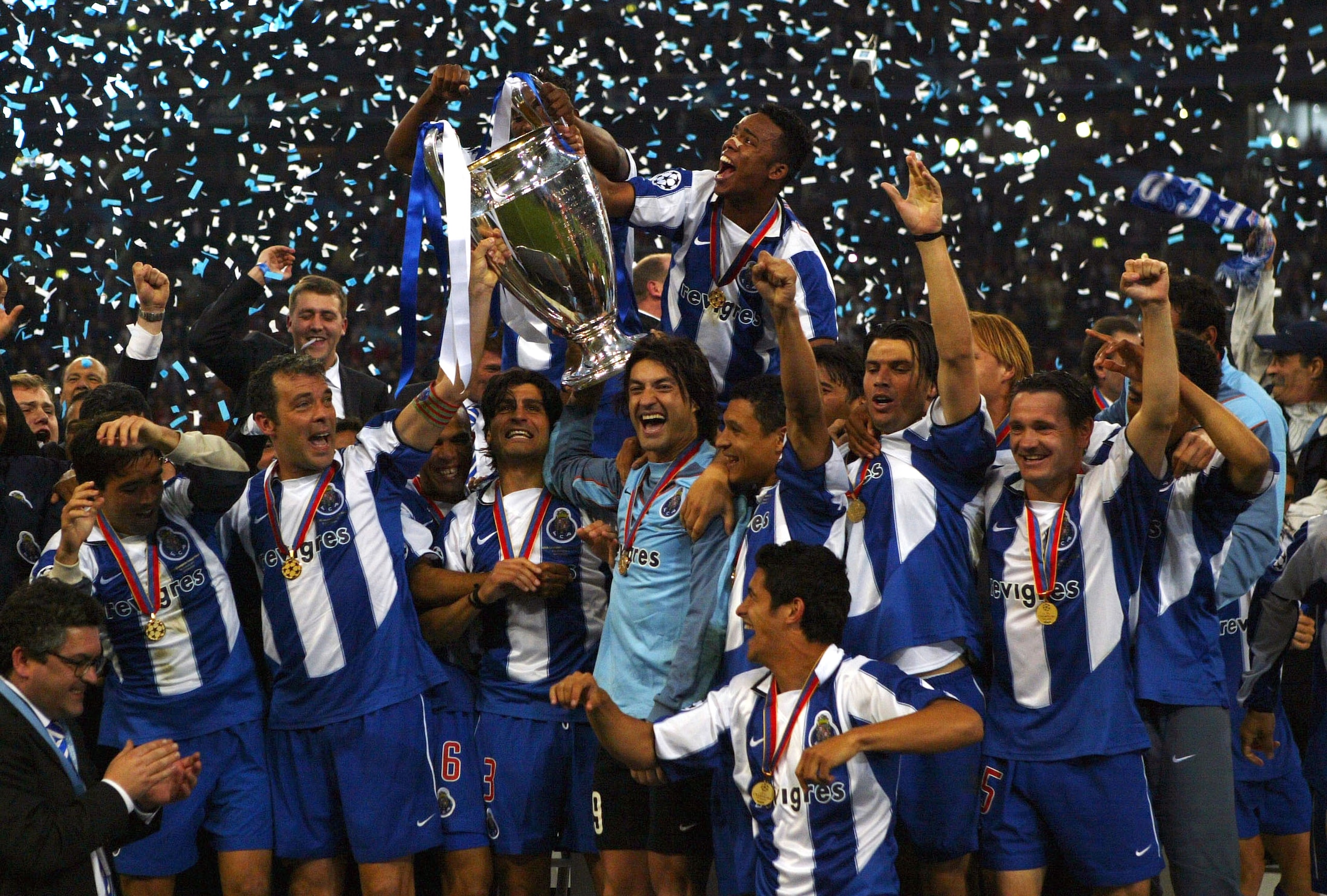 GELSENKIRCHEN, GERMANY - MAY 26:  FC Porto players celebrate winning the Champions League during the UEFA Champions League Final match between AS Monaco and FC Porto at the AufSchake Arena on May 26, 2004 in Gelsenkirchen, Germany.  (Photo by Stuart Frank