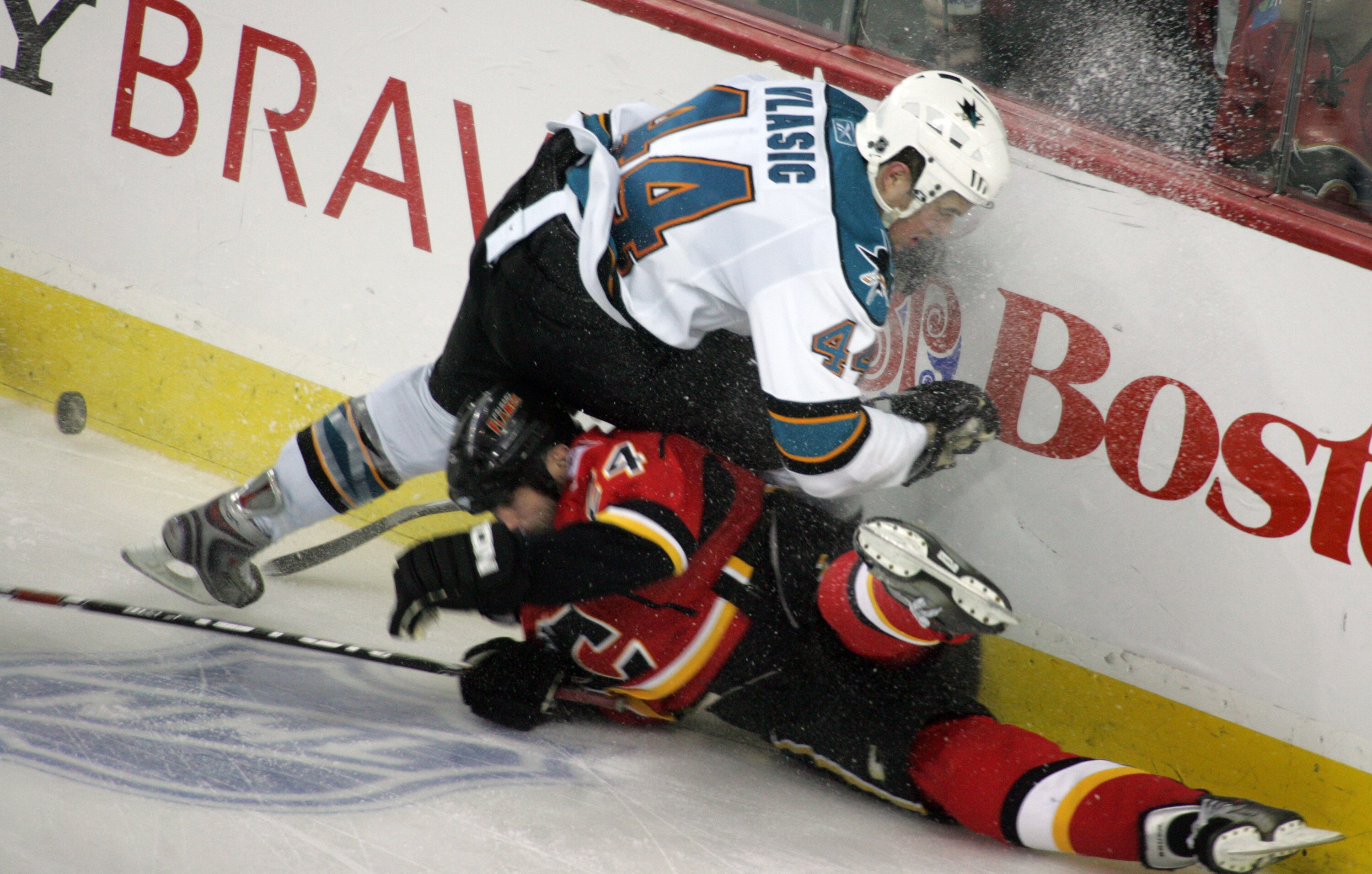 CALGARY, CANADA - APRIL 20: Craig Conroy #24 of the Calgary Flames can't beat Marc-Edouard Vlasic #44 of the San Jose Sharks to the puck for an icing callduring Game 6 of the 2008 NHL Western Conference Quarterfinals at Pengrowth Saddledome April 20, 2008