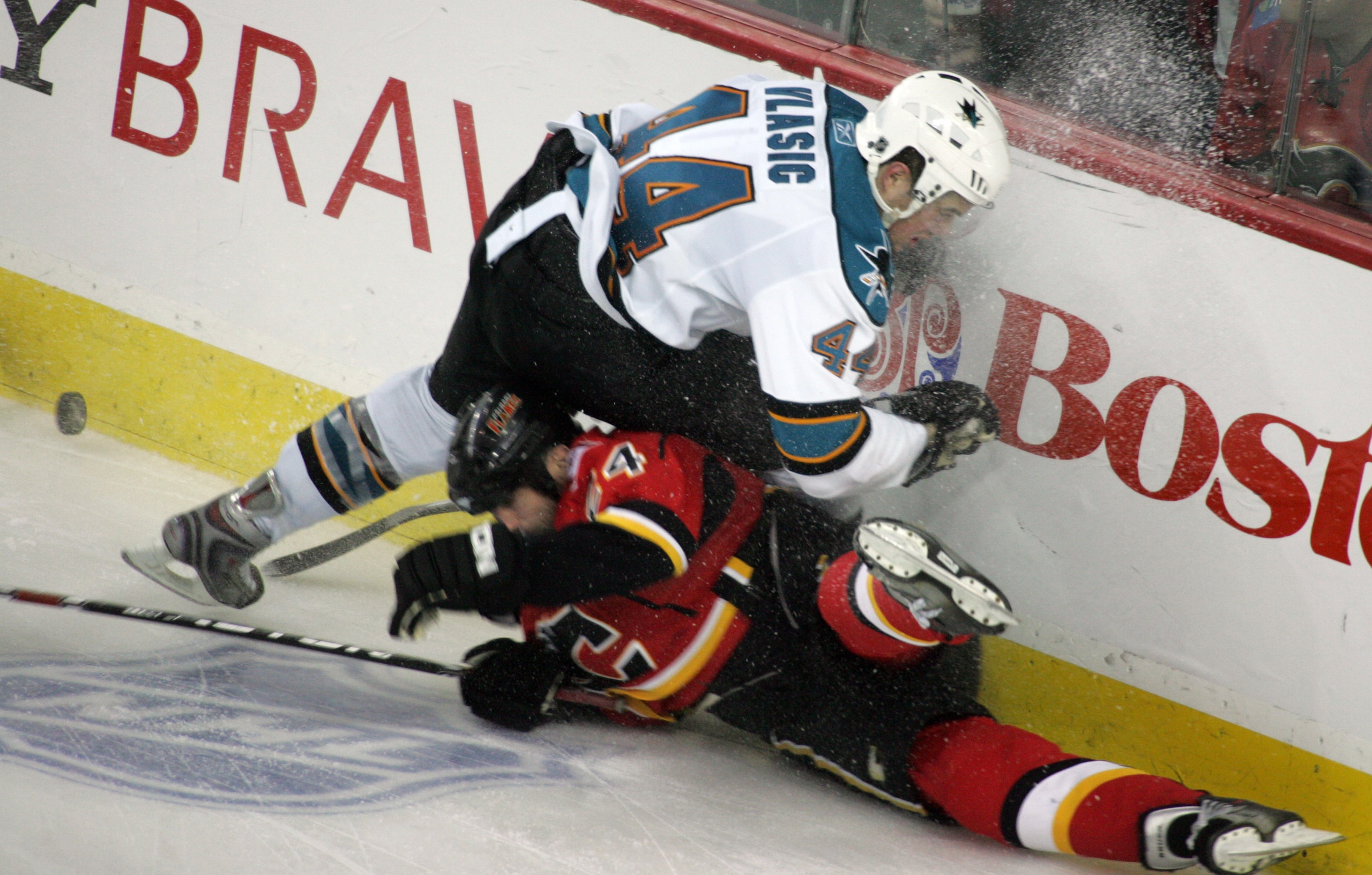 CALGARY, CANADA - APRIL 20: Craig Conroy #24 of the Calgary Flames can't beat Marc-Edouard Vlasic #44 of the San Jose Sharks to the puck for an icing callduring Game 6 of the 2008 NHL Western Conference Quarterfinals at Pengrowth Saddledome April 20, 2008