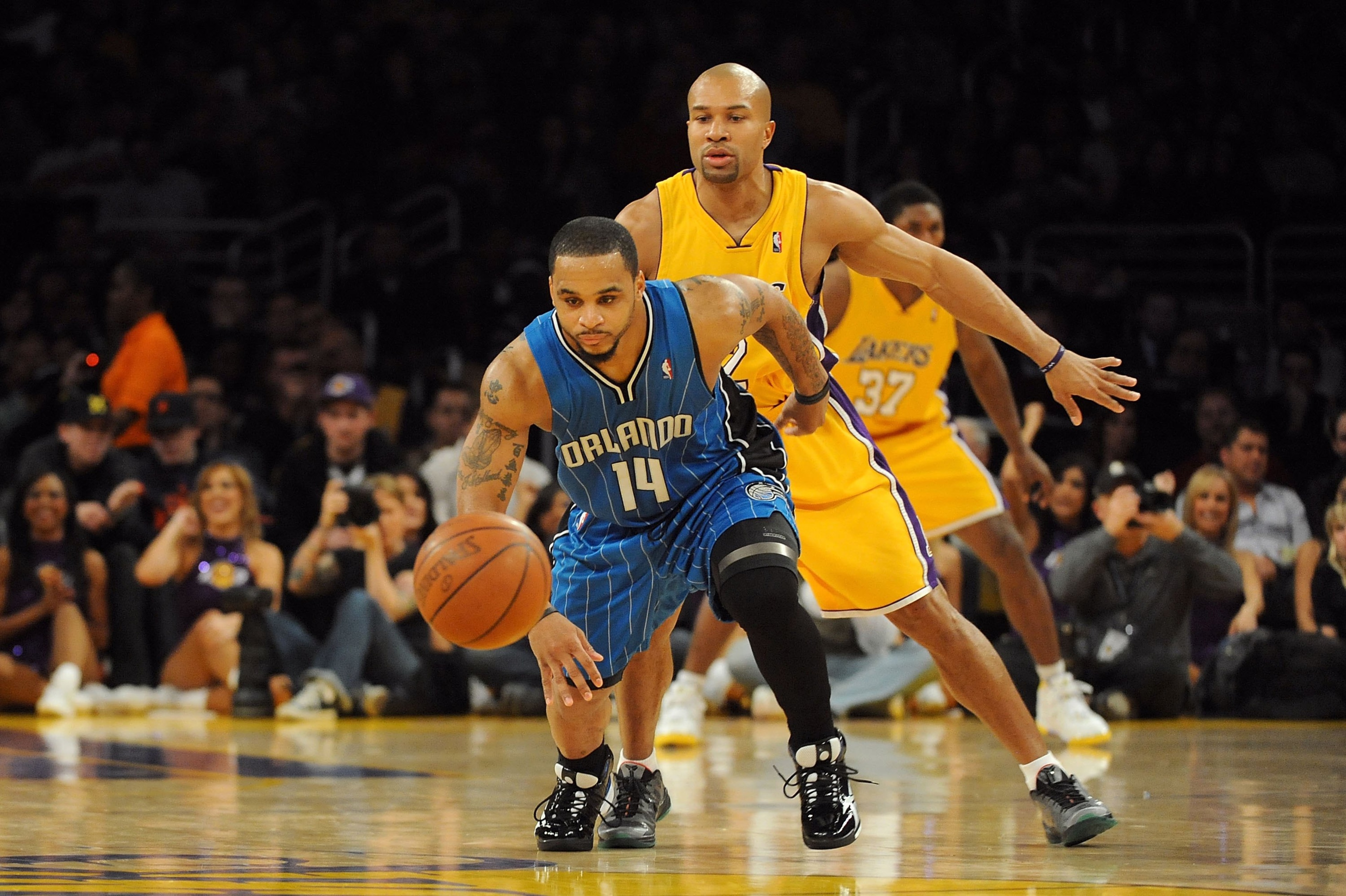 LOS ANGELES, CA - JANUARY 18:  Jameer Nelson #14 of the Orlando Magic goes for the loose ball against Derek Fisher #2 of the Los Angeles Lakers during the game on January 18, 2010 at Staples Center in Los Angeles, California.   The Lakers won 98-92.  NOTE