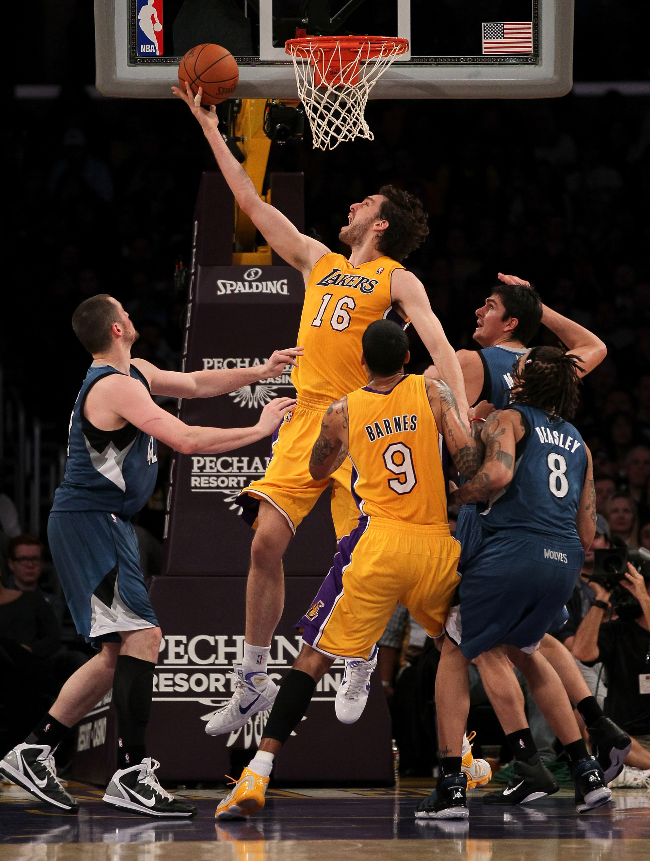 LOS ANGELES, CA - NOVEMBER 09:  Pau Gasol #16 of the Los Angeles Lakers shoots between Darko Milicic #31 and Kevin Love #42 of the Minnesota Timberwolves at Staples Center on November 9, 2010 in Los Angeles, California.   NOTE TO USER: User expressly ackn