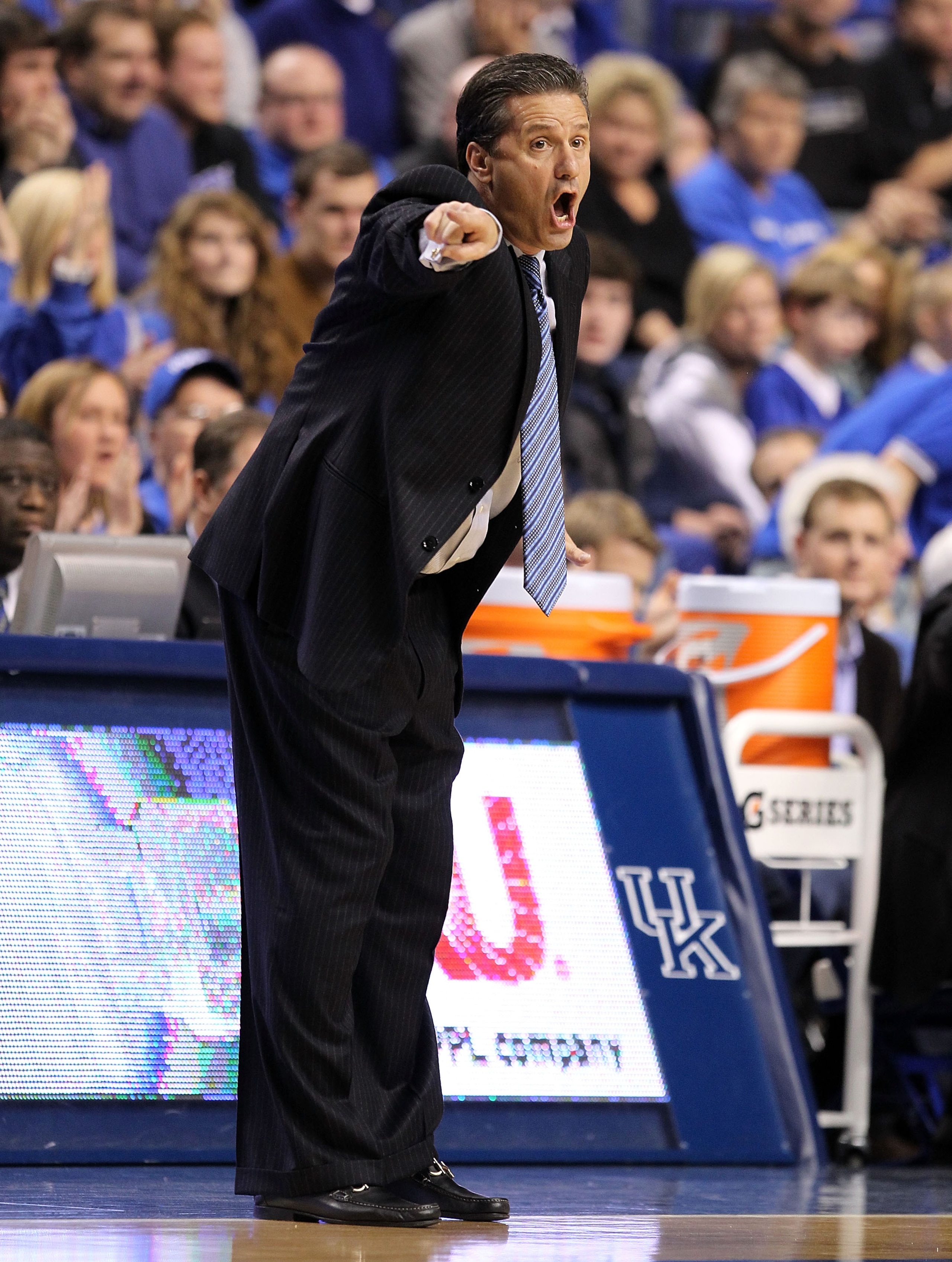 LEXINGTON, KY - JANUARY 03: John Calipari the Head Coach of the Kentucky Wildcats gives instructions to his teaml during the game against the Penn Quakers at Rupp Arena on January 3, 2011 in Lexington, Kentucky.  Kentucky won 86-62.  (Photo by Andy Lyons/