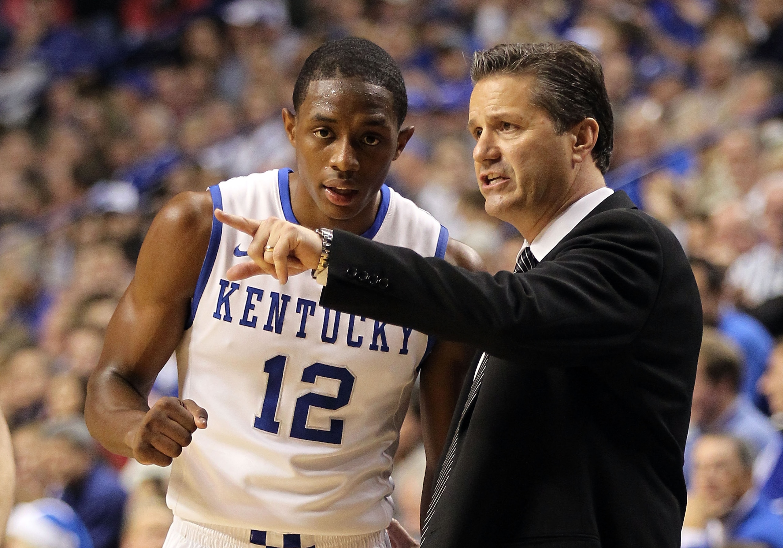 LEXINGTON, KY - DECEMBER 11:  John Calipari the Head Coach of the Kentucky Wildcats talks with  Brandon Knight #12 during the 81-62 victory over the Indiana Hoosiers on December 11, 2010 in Lexington, Kentucky.  (Photo by Andy Lyons/Getty Images)