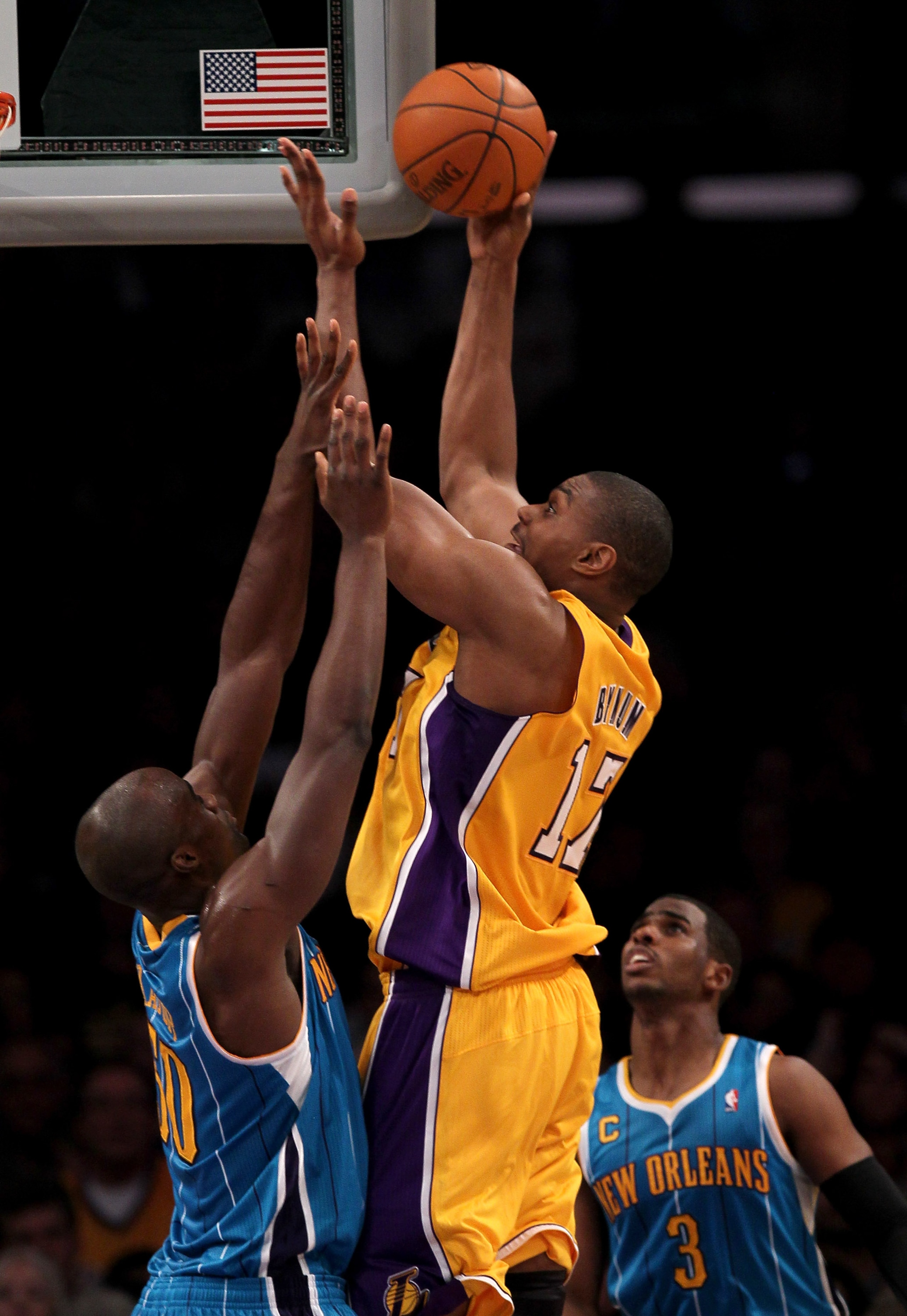 LOS ANGELES, CA - JANUARY 07:  Andrew Bynum #17 of the Los Angeles Lakers shoots over Emeka Okafor #50 of the New Orleans Hornets at Staples Center on January 7, 2011 in Los Angeles, California. The Lakers won 101-97.  NOTE TO USER: User expressly acknowl
