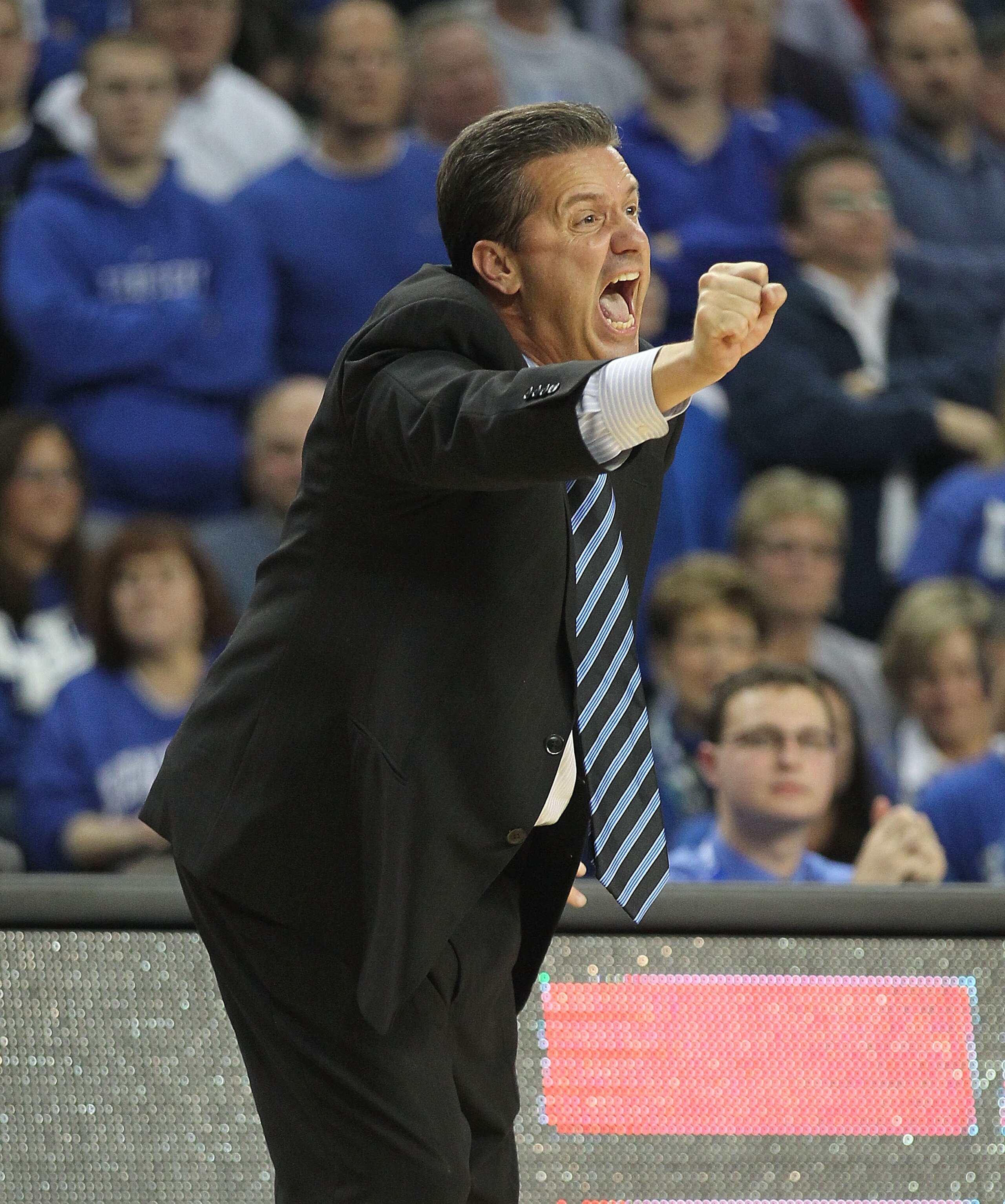 LOUISVILLE, KY - DECEMBER 08:  John Calipari the Head Coach of the Kentucky Wildcats gives instructions to his team during the game against the Notre Dame Fighting Irish in the 2010 DIRECTV SEC/BIG EAST Invitational at Freedom Hall on December 8, 2010 in