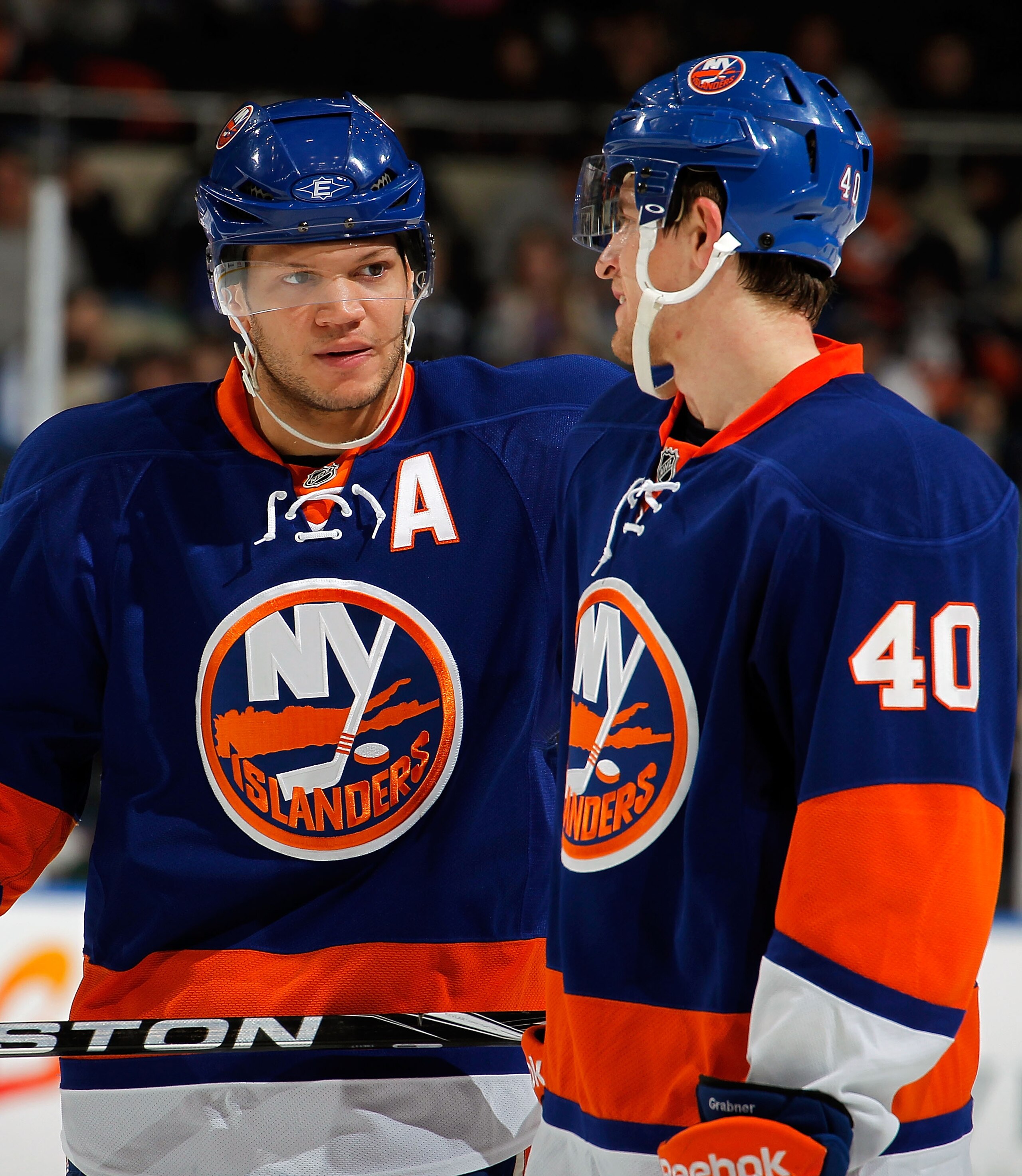 UNIONDALE, NY - FEBRUARY 21:  Michael Grabner #40 and Kyle Okposo #21 of the New York Islanders talk while waiting for a faceoff during an NHL hockey game against the Florida Panthers at the Nassau Coliseum on February 21, 2011 in Uniondale, New York.  (P