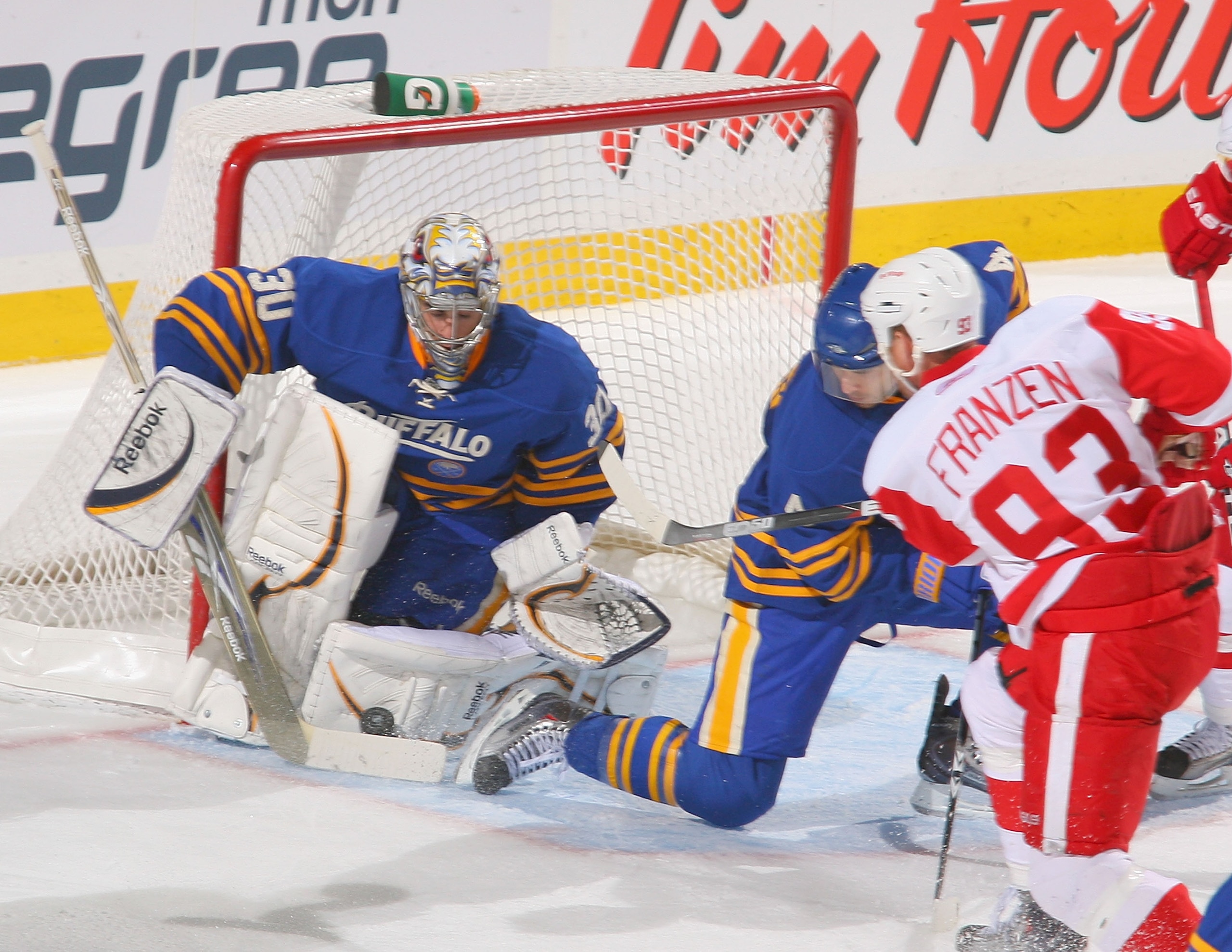 BUFFALO, NY - FEBRUARY 26: Ryan Miller #30 of the Buffalo Sabres makes a save on Johan Franzen #93 of the Detroit Red Wings at HSBC Arena on February 26, 2011 in Buffalo, New York.  (Photo by Rick Stewart/Getty Images)