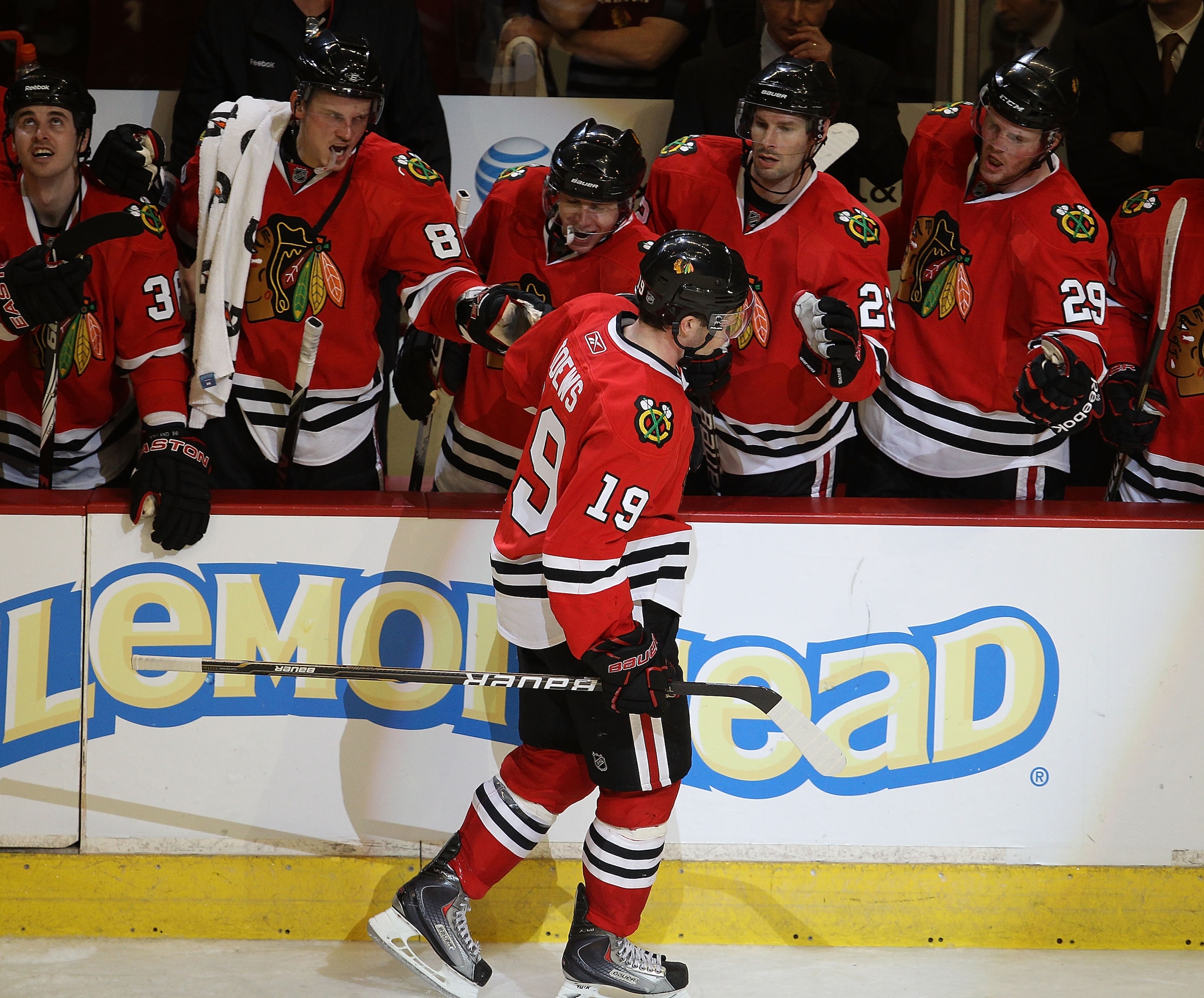 CHICAGO, IL - FEBRUARY 27: Jonathan Toews #19 of the Chicago Blackhawks is congratulated by teammates including (L-R) Tomas Kopecky #82, Patrick Kane #88, Troy Brouwer #22 and Bryan Bickell #29 after scoring the winning goal in a shootout against the Phoe