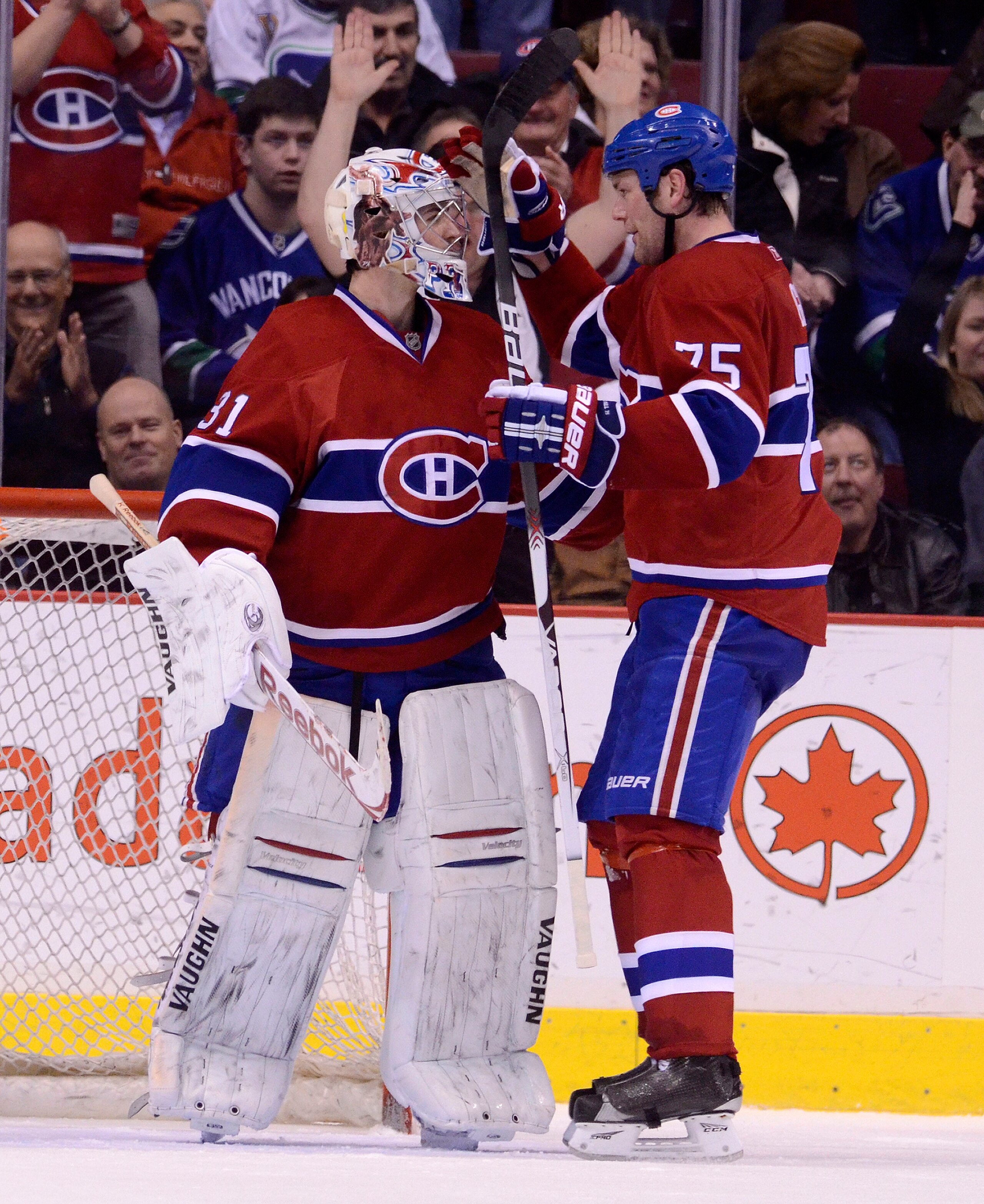 VANCOUVER, CANADA - FEBRUARY 22: Goalie Carey Price #31 of the Montreal Canadiens is congratulated by Hal Gill #75 after defeating the Vancouver Canucks in NHL action on February 22, 2011 at Rogers Arena in Vancouver, British Columbia, Canada.  (Photo by
