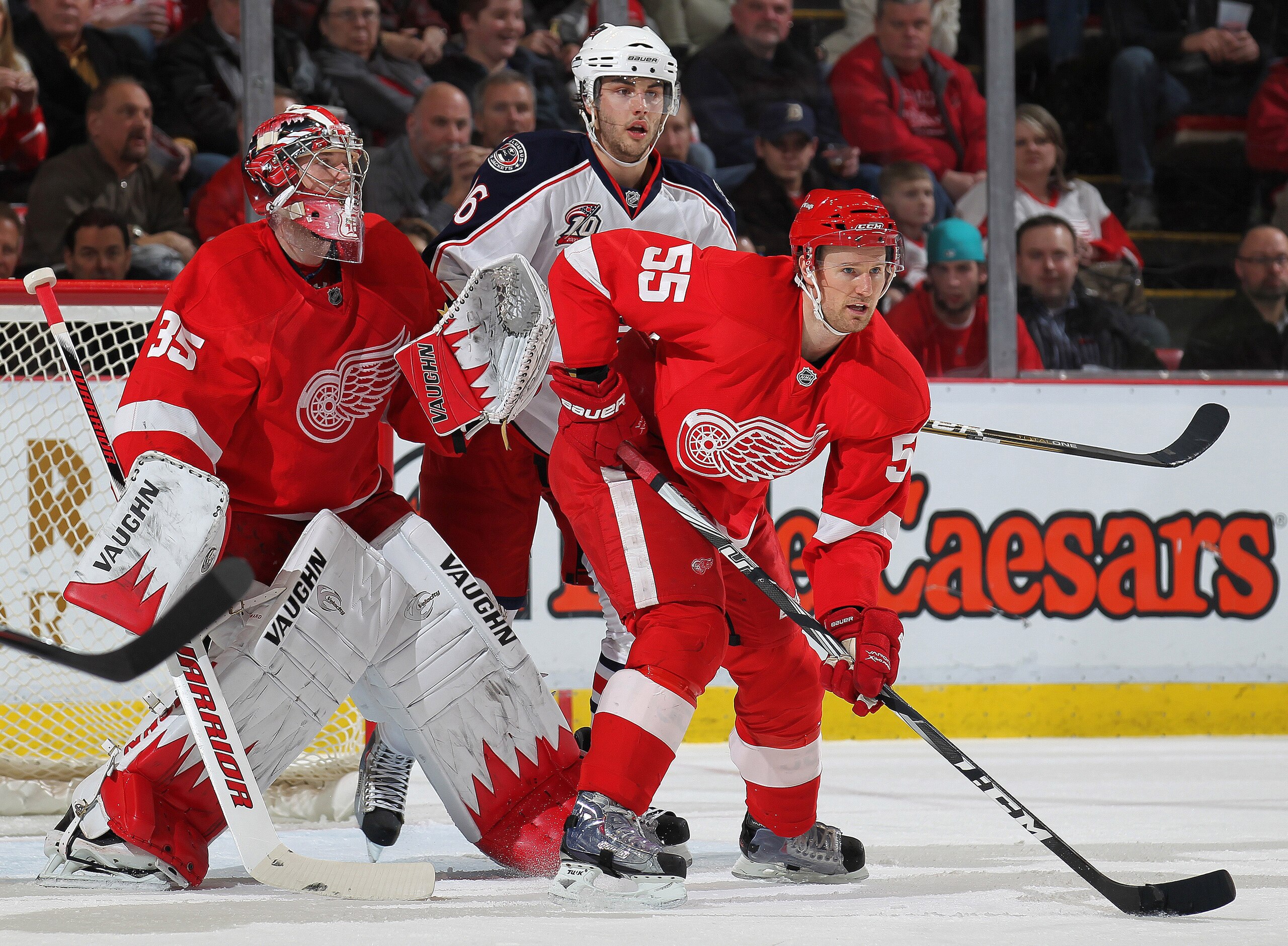 DETROIT, MI - FEBRUARY 4:  Derick Brassard #16 of the Columbus Blue Jackets squeezes between Jimmy Howard #35 and Niklas Kronwall #55 of the Detroit Red Wings on February 4, 2011 at the Joe Louis Arena in Detroit, Michigan. (Photo by Claus Andersen/Getty