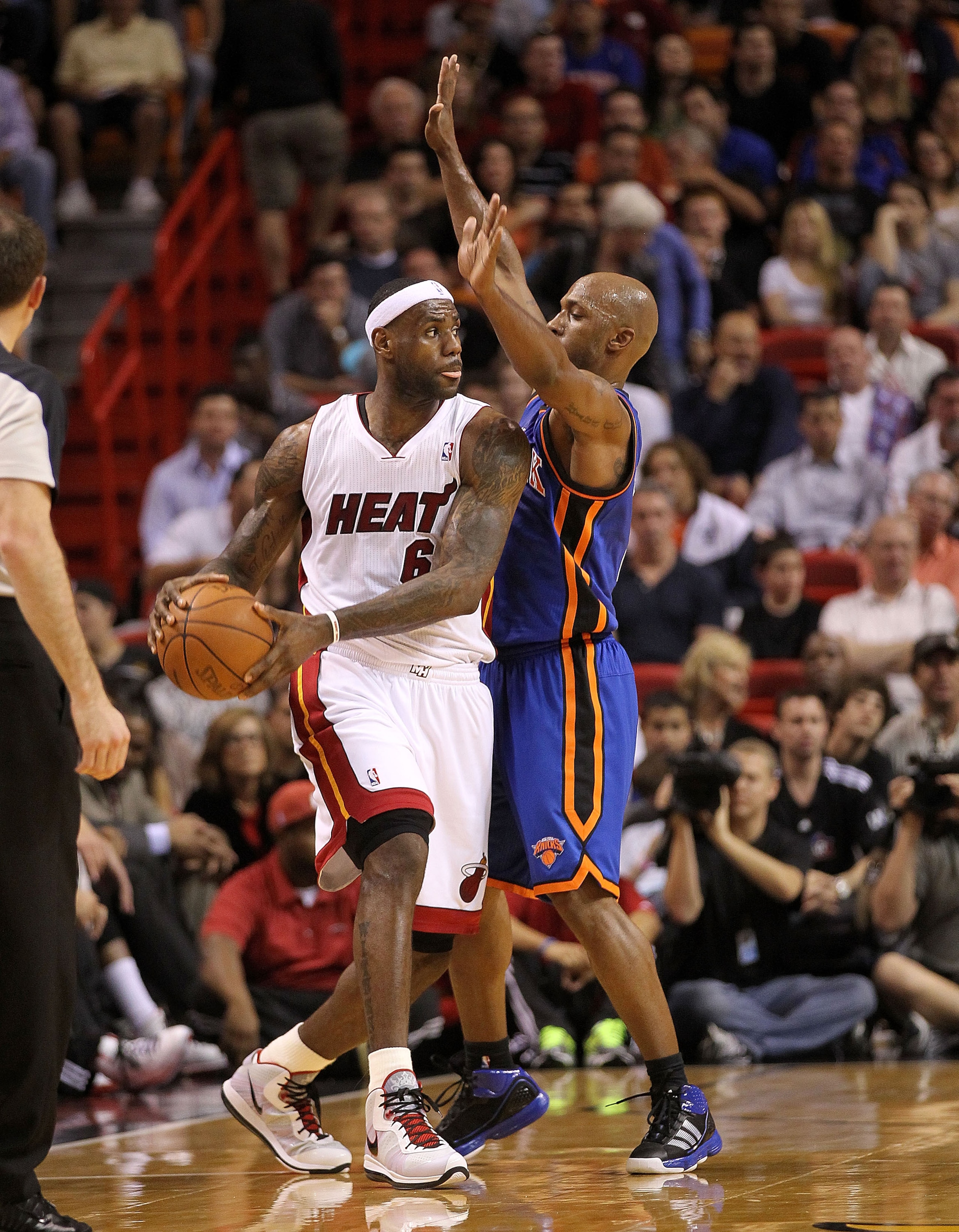 MIAMI, FL - FEBRUARY 27:  LeBron James #6 of the Miami Heat is guarded by Chauncey Billups #4 of the New York Knicks during a game at American Airlines Arena on February 27, 2011 in Miami, Florida. NOTE TO USER: User expressly acknowledges and agrees that