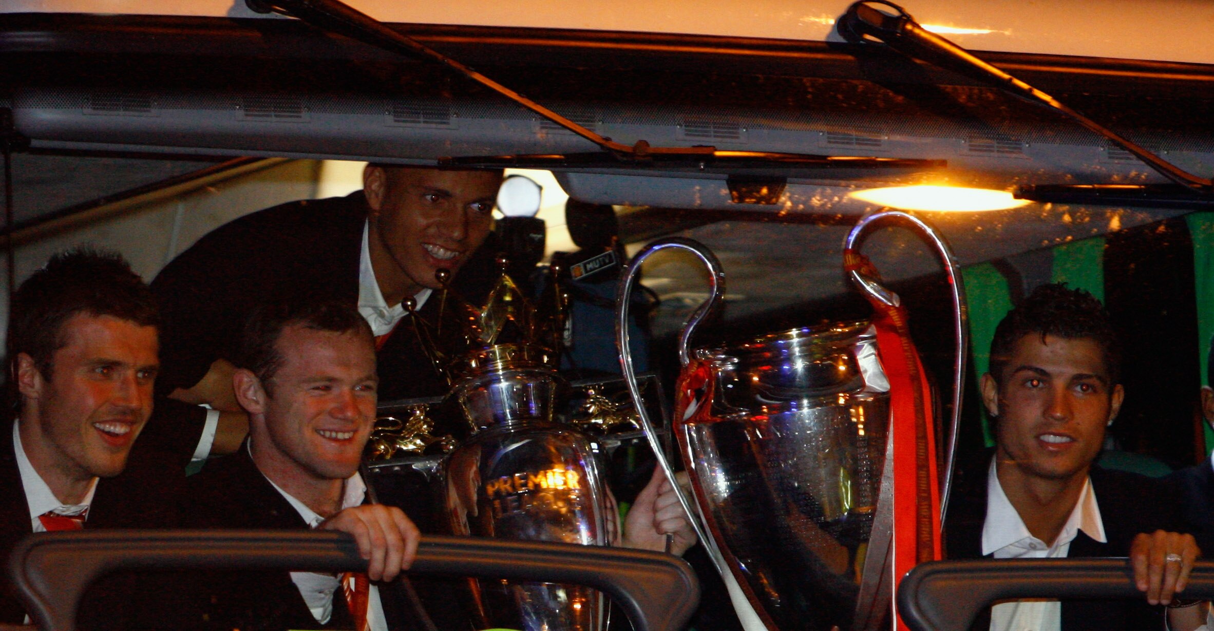 MANCHESTER - MAY 22:  Michael Carrick, Wayne Rooney and Cristiano Ronaldo arrive back from Moscow after their win over Chelsea in the Champions League final May 22, 2008 in Manchester, England.  (Photo by Jeff J Mitchell/Getty Images)