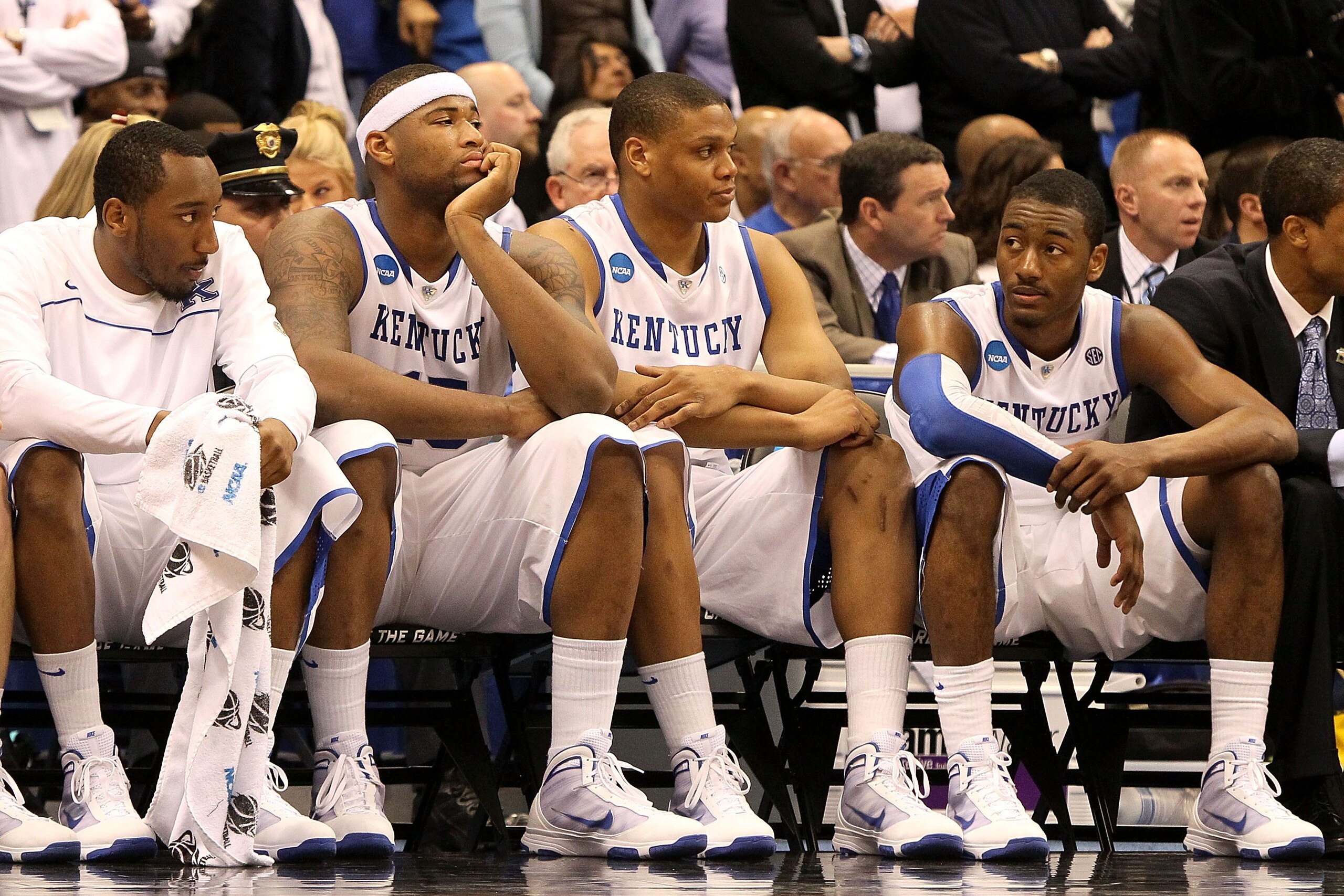 SYRACUSE, NY - MARCH 27:  (L-R) Ramon Harris #5, DeMarcus Cousins #15, Daniel Orton #33 and John Wall #11 of the Kentucky Wildcats look on dejected from the bench in the final minute of the second half against the West Virginia Mountaineers during the eas