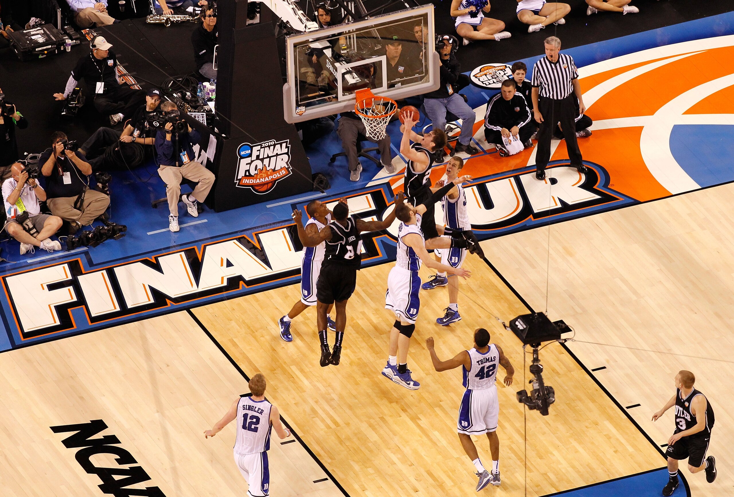INDIANAPOLIS - APRIL 05:  A detail of a suspended overhead video camera films Gordon Hayward #20 of the Butler Bulldogs as he drives to the basket against the Duke Blue Devils during the 2010 NCAA Division I Men's Basketball National Championship game at