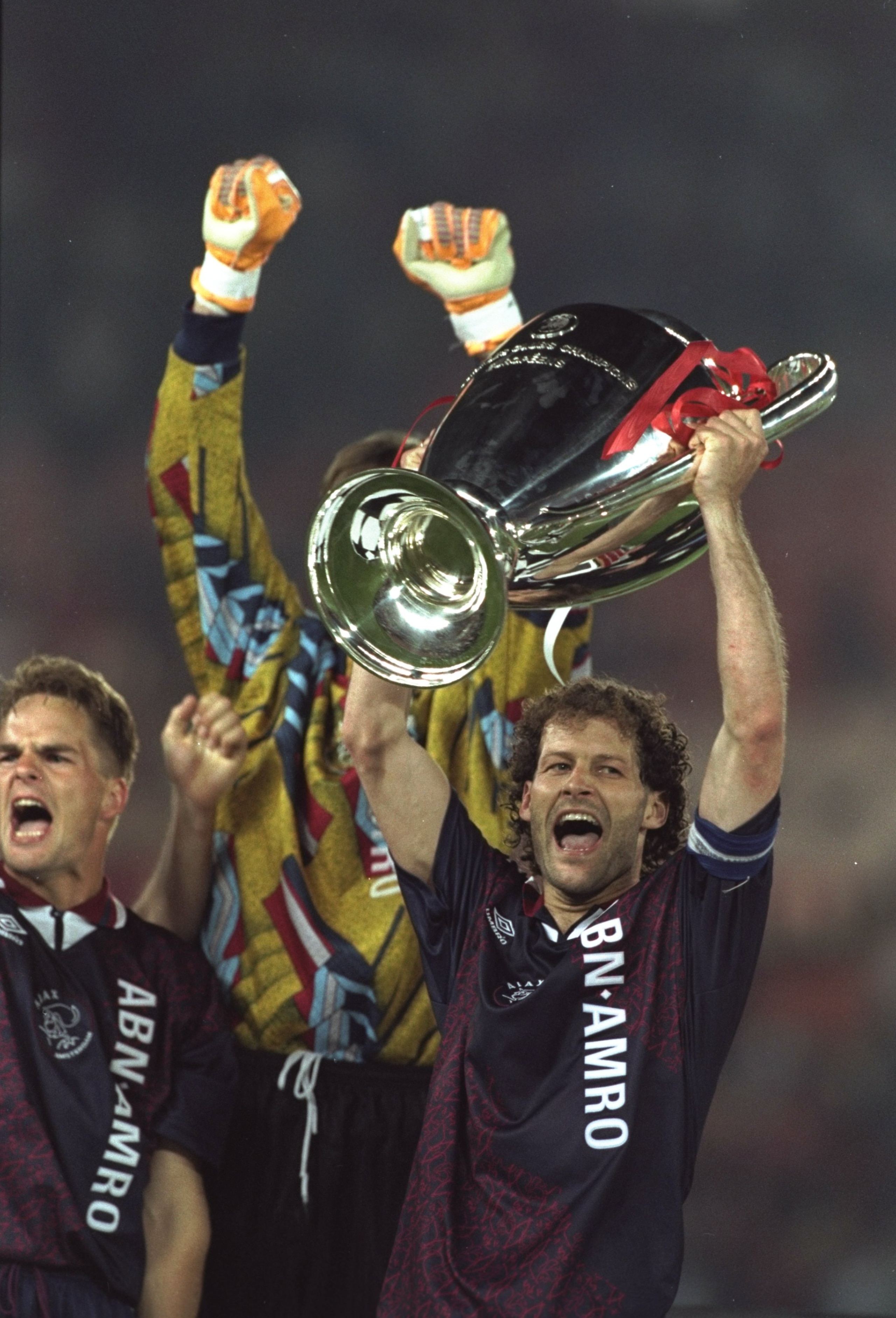24 May 1995:  Danny Blind of Ajax raises the trophy in celebration after their victory in the European Cup Final against Milan in Vienna, Austria. Ajax won the match 1-0. \ Mandatory Credit: Clive  Brunskill/Allsport