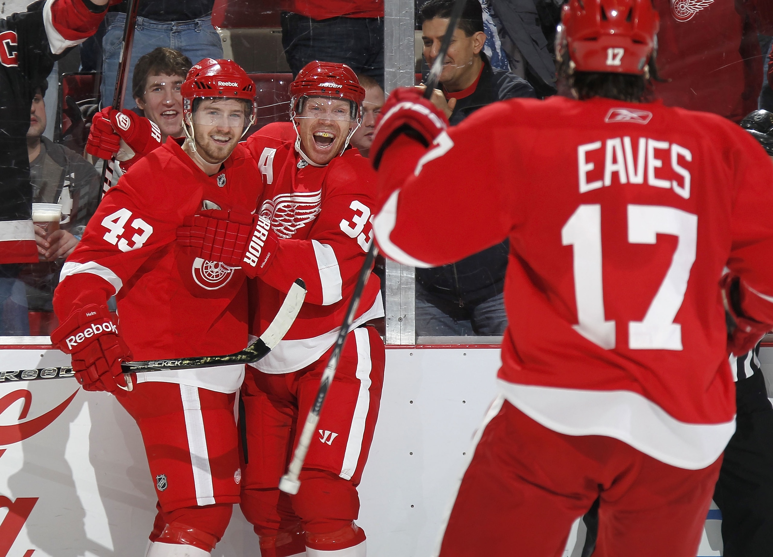 DETROIT, MI - FEBRUARY 13: Kris Draper #33 of the Detroit Red Wings celebrates a second period goal with Darren Helm #43 and Patrick Eaves #17 while playing the Boston Bruins on February 13, 2011 at Joe Lewis Arena in Detroit, Michigan. (Photo by Gregor DETROIT, MI - FEBRUARY 13: Kris Draper #33 of the Detroit Red Wings celebrates a second period goal with Darren Helm #43 and Patrick Eaves #17 while playing the Boston Bruins on February 13, 2011 at Joe Lewis Arena in Detroit, Michigan. (Photo by Gregor
