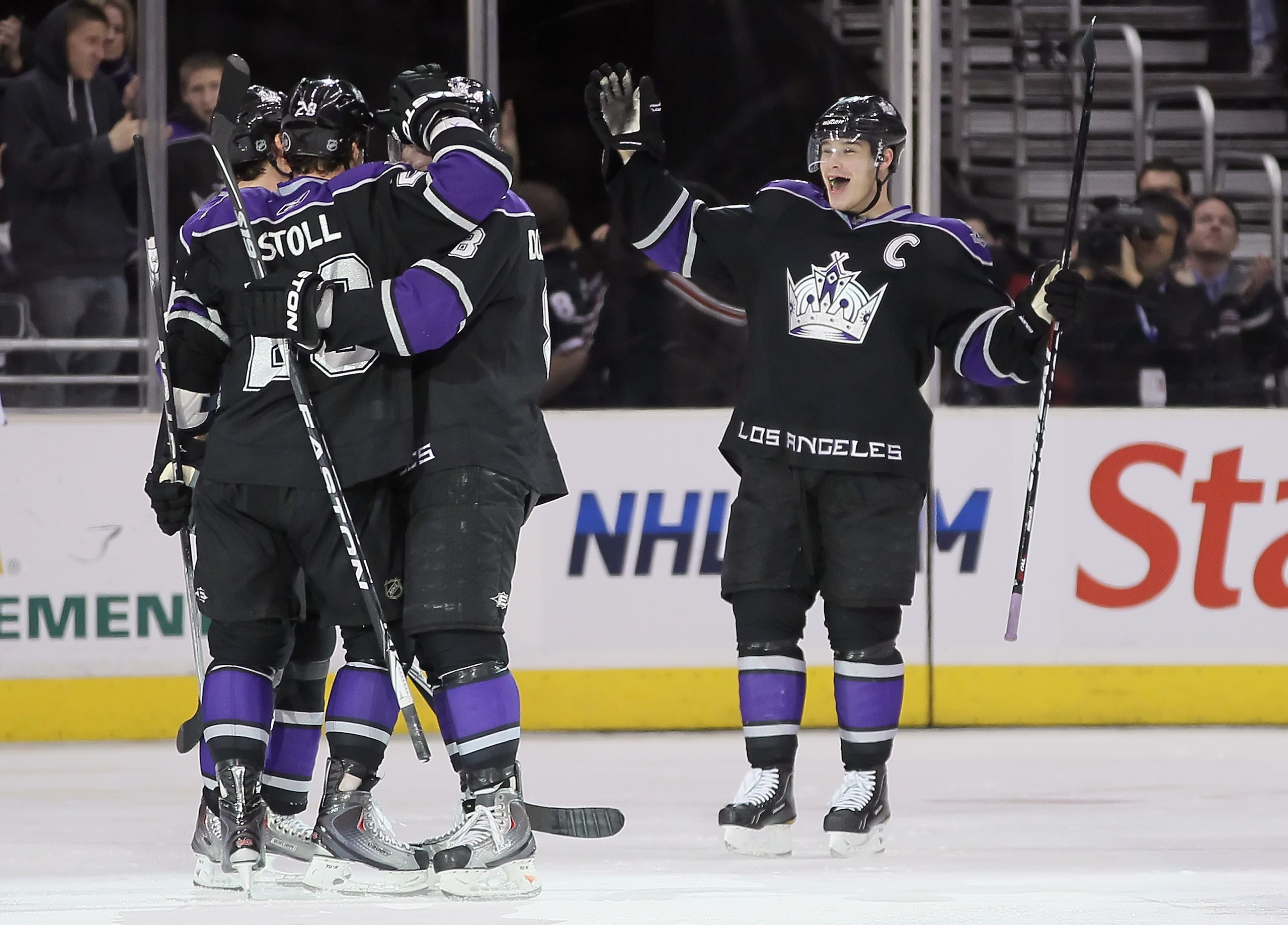 LOS ANGELES, CA - FEBRUARY 26: (L-R) Jarret Stoll #28, Drew Doughty #8 and Dustin Brown #23 of the Los Angeles Kings celebrate Stoll's third period goal against the Colorado Avalanche at Staples Center on February 26, 2011 in Los Angeles, California. The LOS ANGELES, CA - FEBRUARY 26: (L-R) Jarret Stoll #28, Drew Doughty #8 and Dustin Brown #23 of the Los Angeles Kings celebrate Stoll's third period goal against the Colorado Avalanche at Staples Center on February 26, 2011 in Los Angeles, California. The