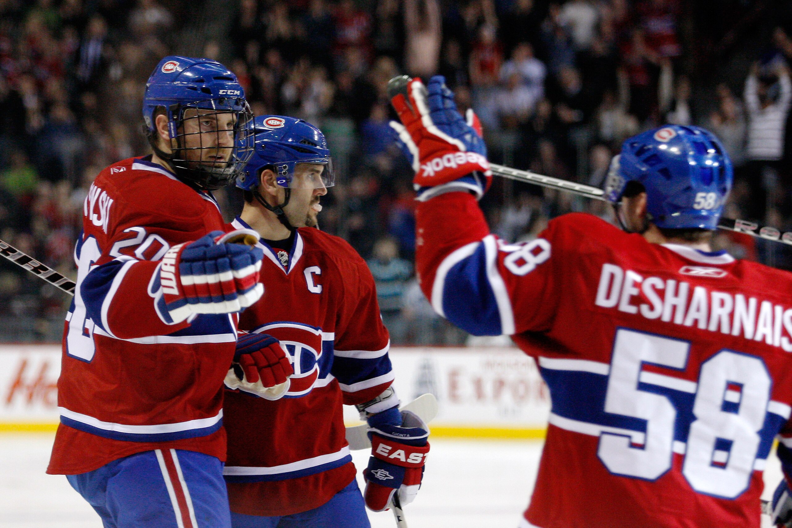MONTREAL, CANADA - FEBRUARY 24: James Wisniewski #20 of the Montreal Canadiens celebrates his second period goal with team mates during the NHL game against the Toronto Maple Leafs at the Bell Centre on February 24, 2011 in Montreal, Quebec, Canada. (Ph MONTREAL, CANADA - FEBRUARY 24: James Wisniewski #20 of the Montreal Canadiens celebrates his second period goal with team mates during the NHL game against the Toronto Maple Leafs at the Bell Centre on February 24, 2011 in Montreal, Quebec, Canada. (Ph