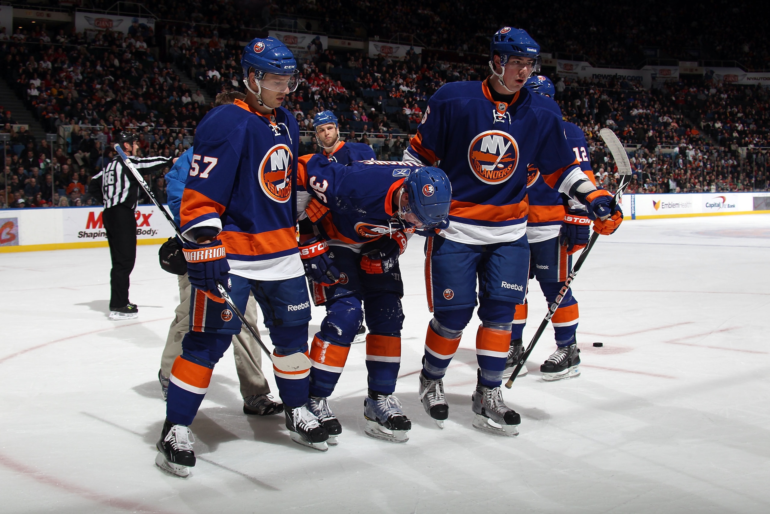 UNIONDALE, NY - FEBRUARY 26: Travis Hamonic #36 of the New York Islanders leave the ice after being hit by a puck in the first period against the Washington Capitals at the Nassau Coliseum on February 26, 2011 in Uniondale, New York. (Photo by Bruce Ben UNIONDALE, NY - FEBRUARY 26: Travis Hamonic #36 of the New York Islanders leave the ice after being hit by a puck in the first period against the Washington Capitals at the Nassau Coliseum on February 26, 2011 in Uniondale, New York. (Photo by Bruce Ben